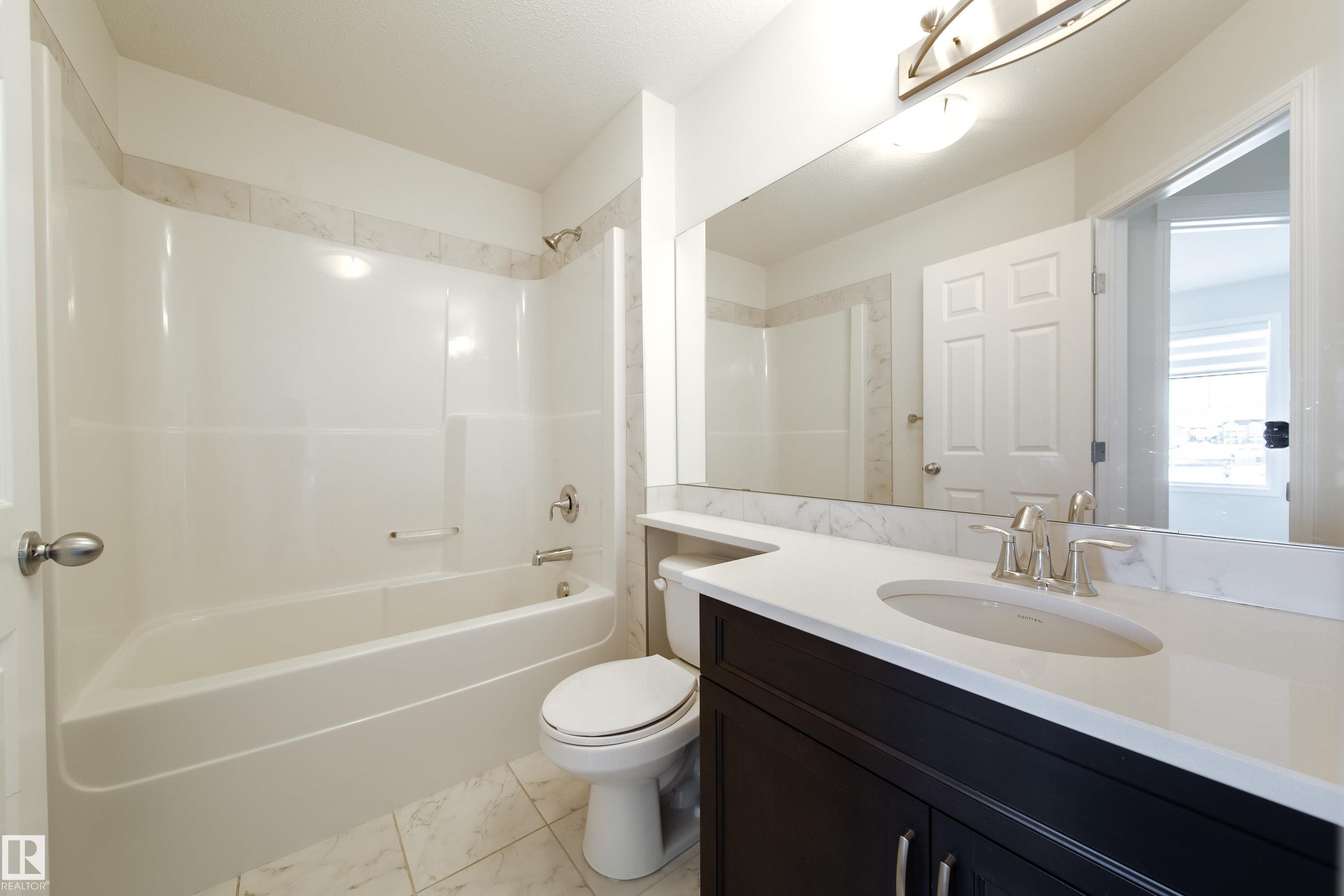 Bathroom with vanity and shower / tub combination - 1199 Watt Drive, Edmonton, AB - Indoor Photo Showing Bathroom