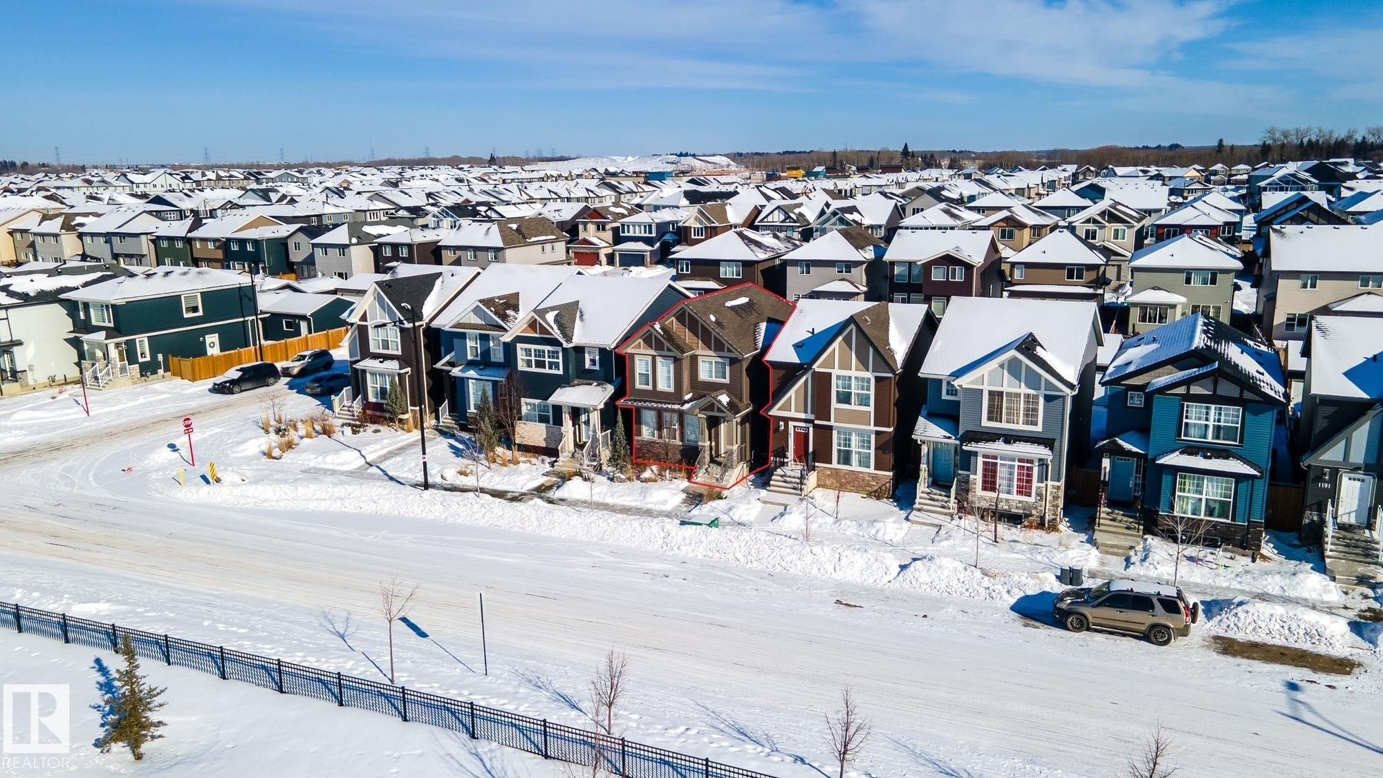 Snowy aerial view with a residential view - 1199 Watt Drive, Edmonton, AB - Outdoor With Facade