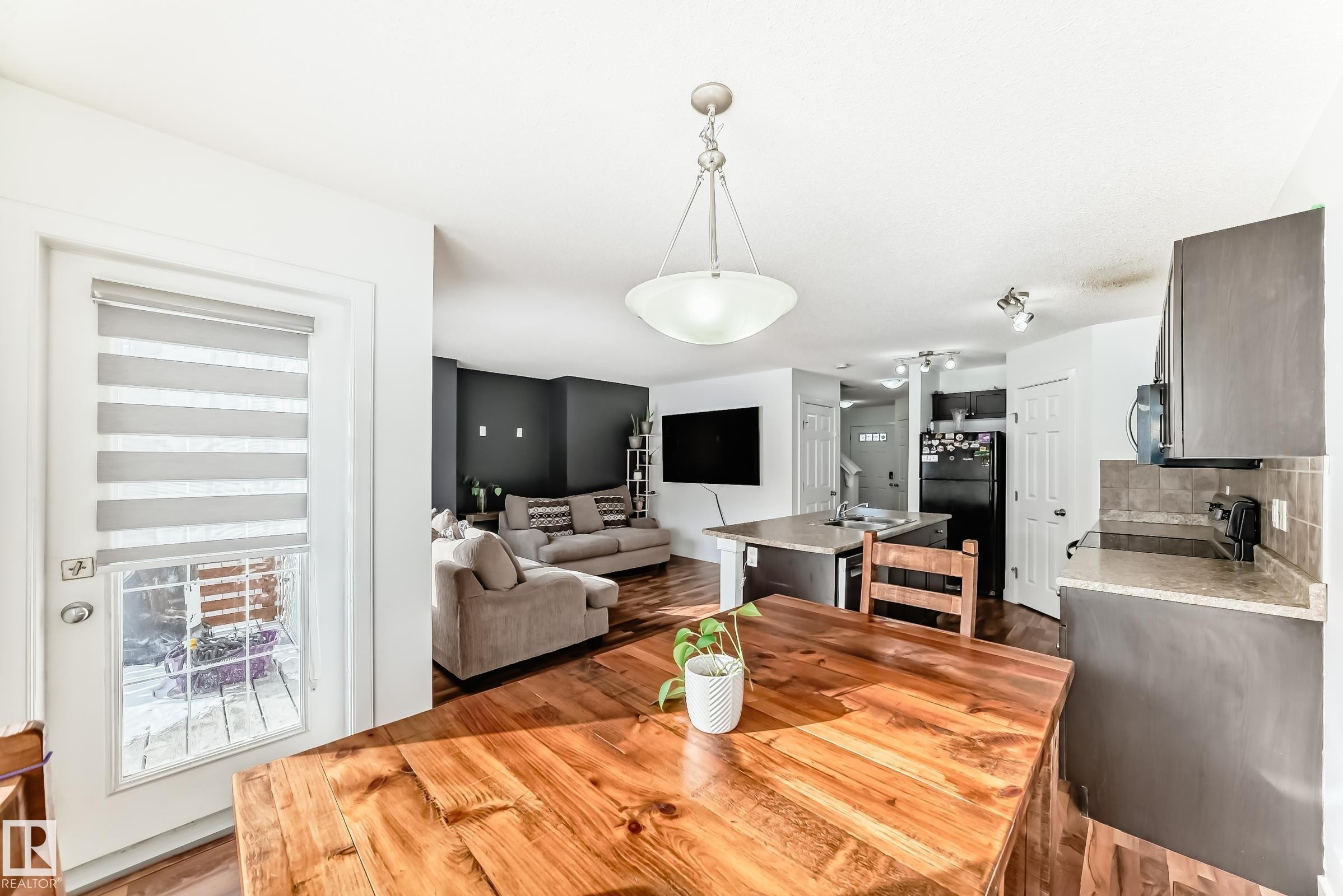 Dining room with light wood-style floors - 17357 8A Avenue, Edmonton, AB