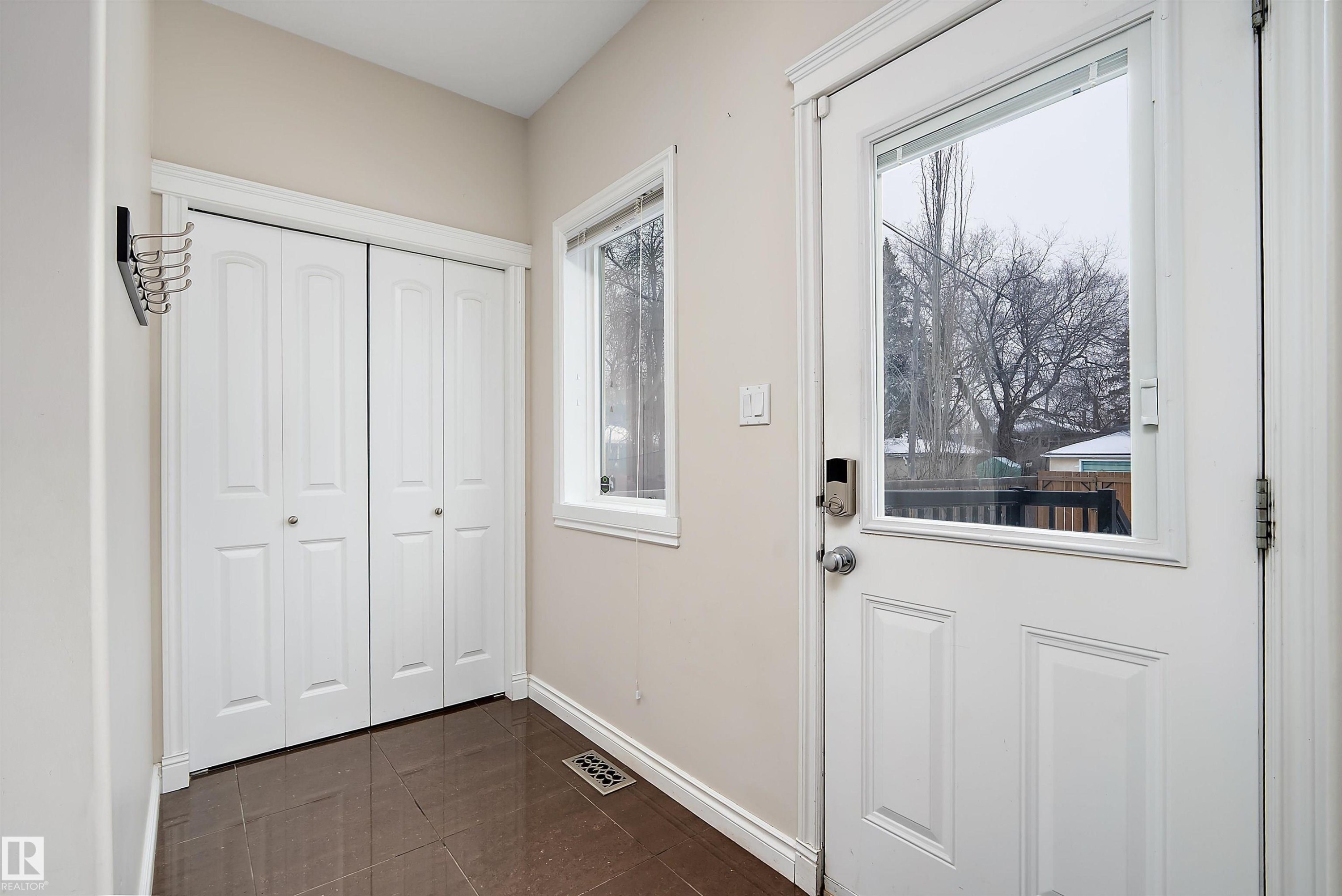 Entryway with baseboards and tile patterned flooring - 10623 75 Avenue, Edmonton, AB - Indoor Photo Showing Other Room