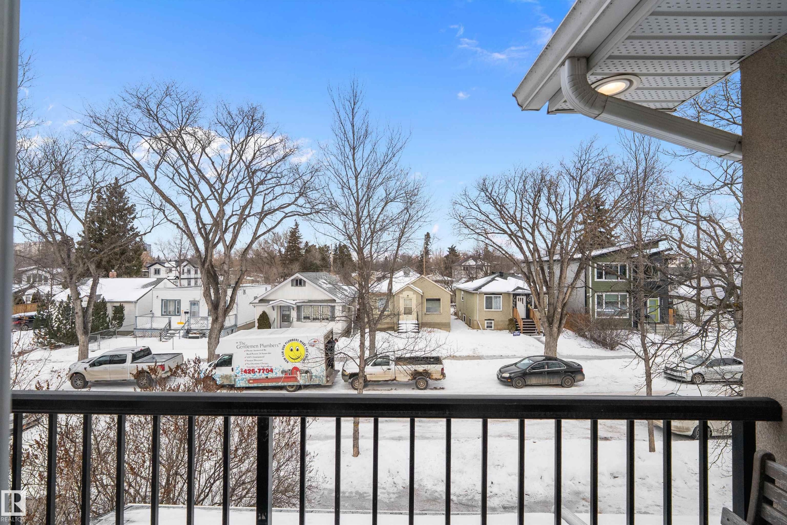 Snow covered back of property featuring a residential view - 10623 75 Avenue, Edmonton, AB - Outdoor