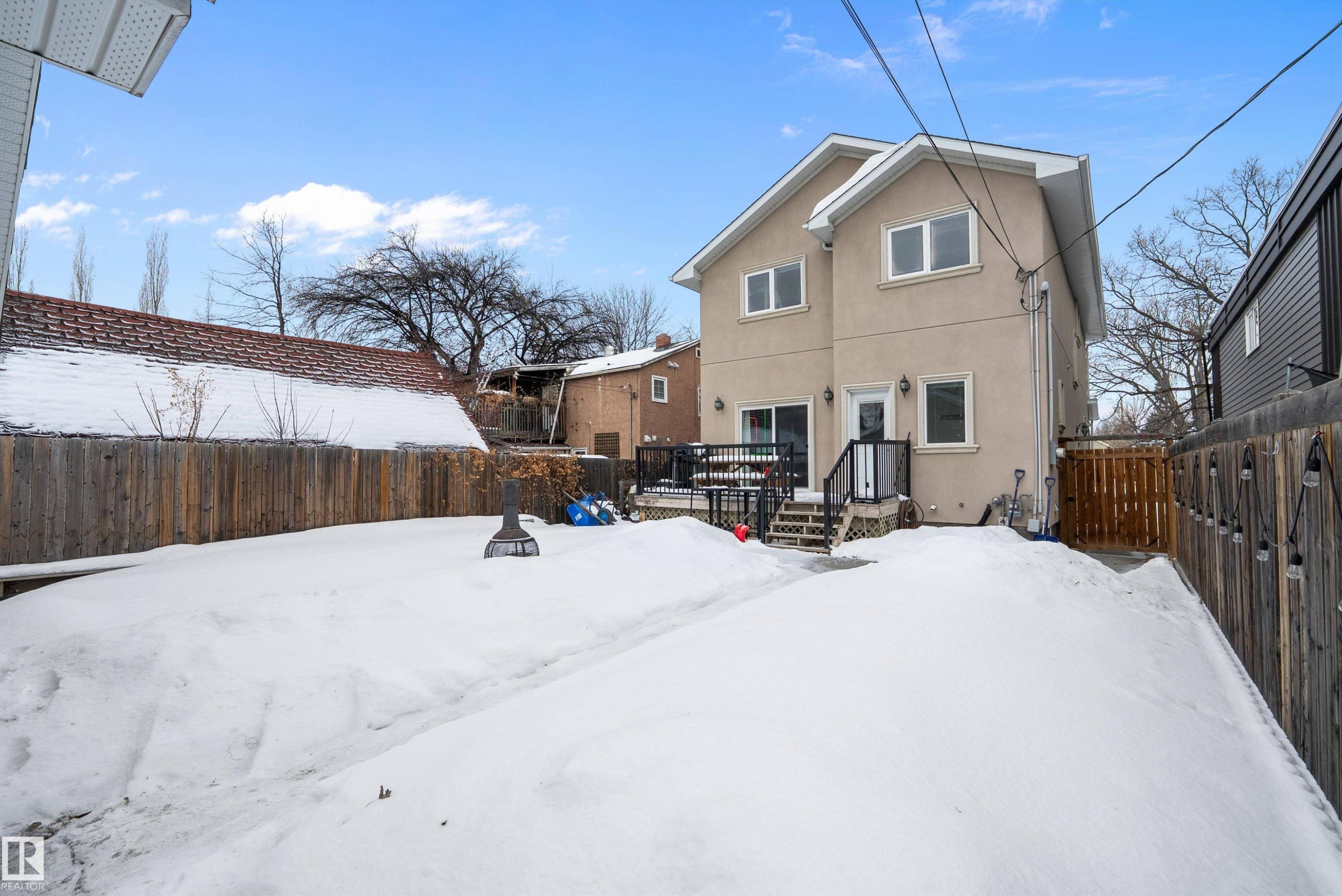 Back of property featuring stucco siding and a fenced backyard - 10623 75 Avenue, Edmonton, AB - Outdoor With Exterior