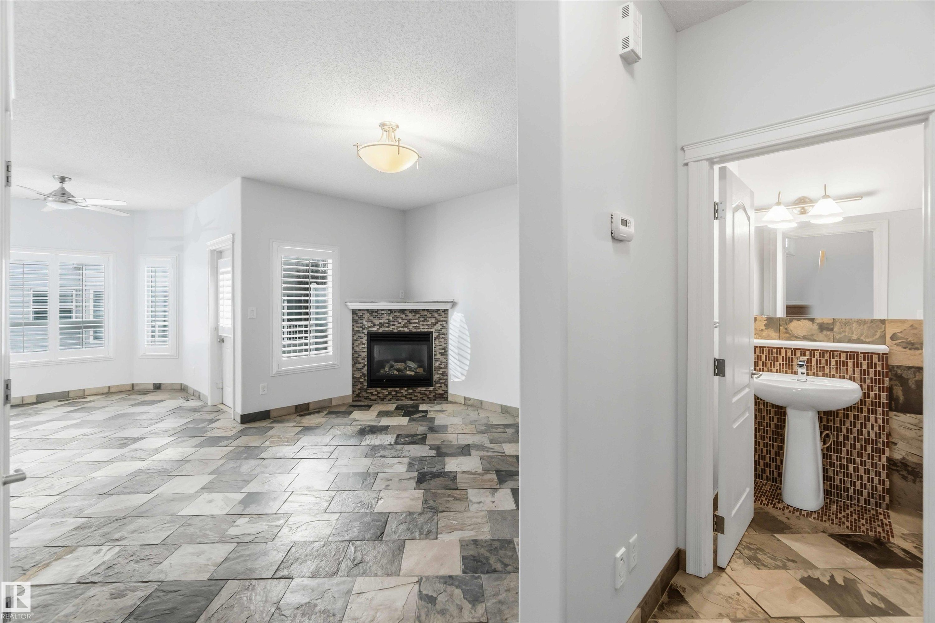9 3003 34 Avenue, Edmonton, AB - Indoor Photo Showing Other Room With Fireplace