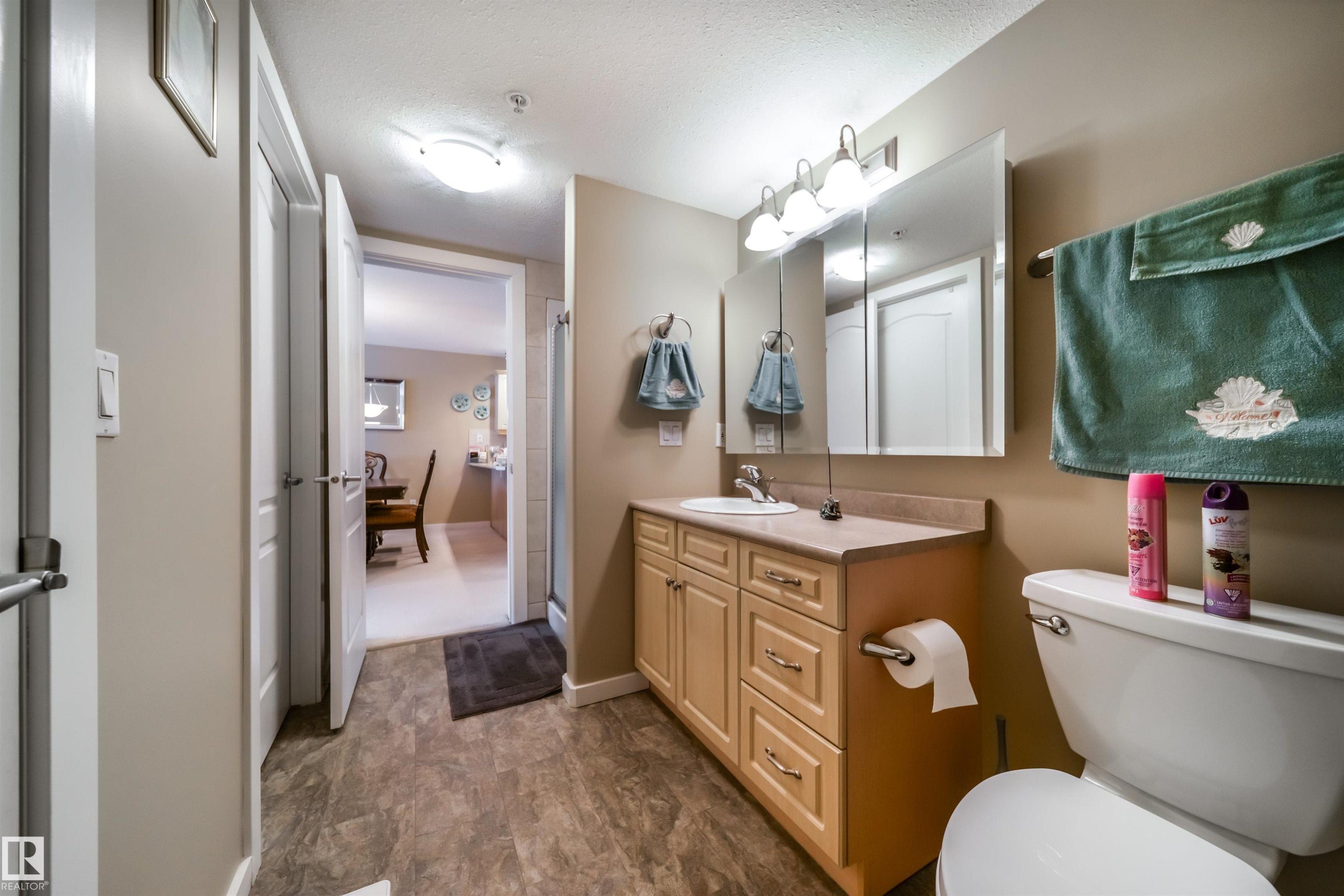 Full bath featuring vanity and a shower stall - 237 278 Suder Greens Drive, Edmonton, AB - Indoor Photo Showing Laundry Room