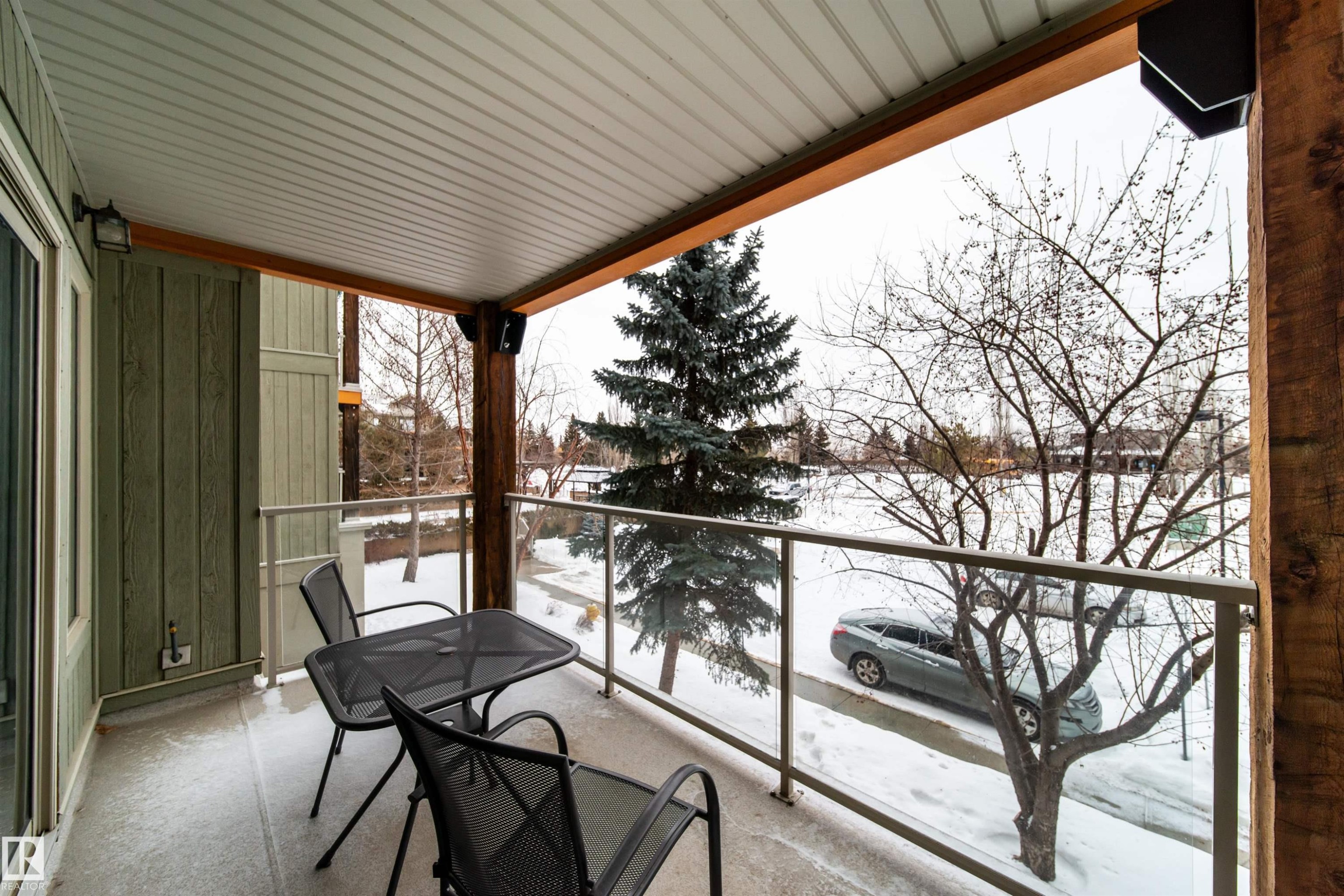 View of snow covered back of property - 237 278 Suder Greens Drive, Edmonton, AB - Indoor Photo Showing Dining Room