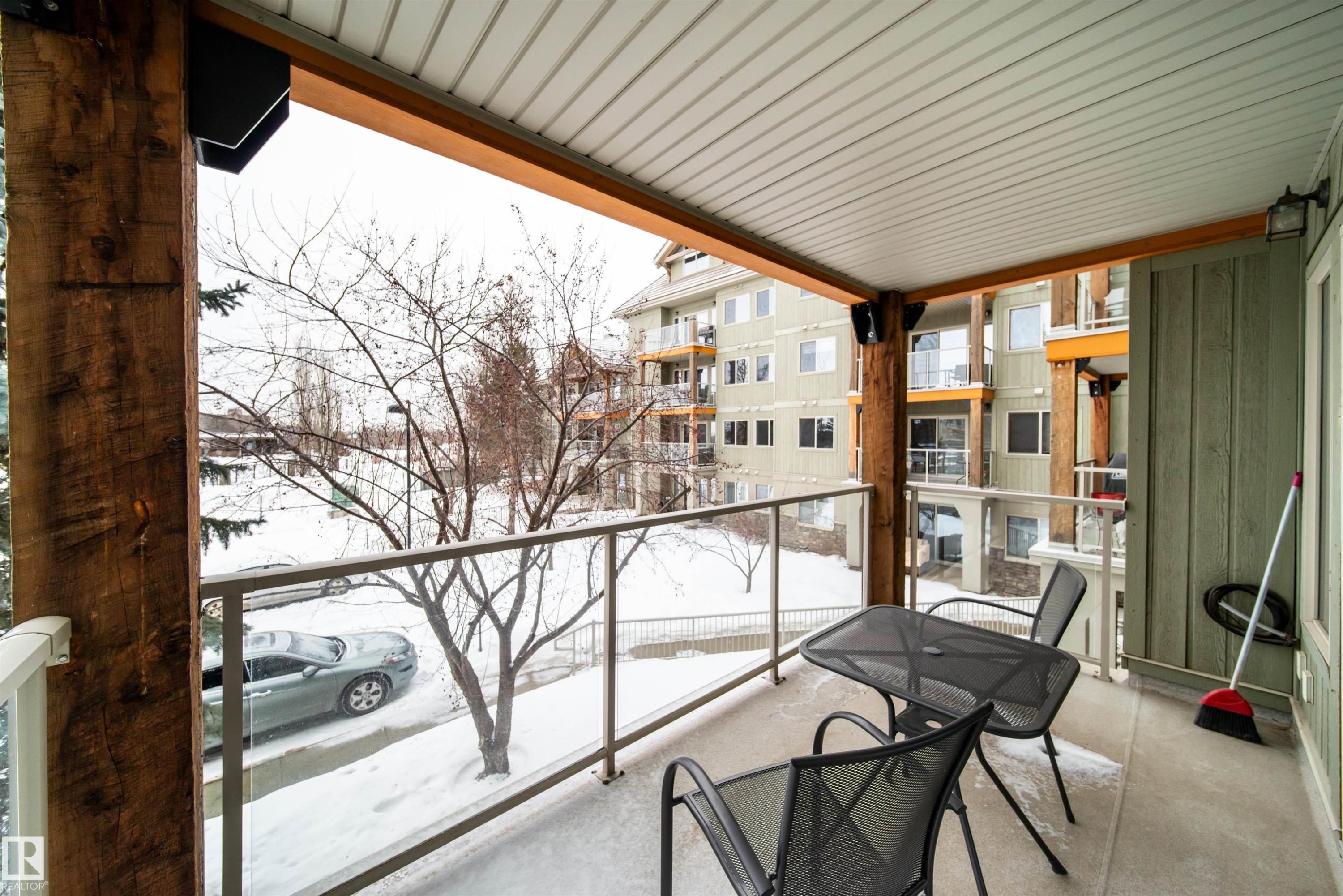 View of snow covered back of property - 237 278 Suder Greens Drive, Edmonton, AB - Indoor Photo Showing Garage