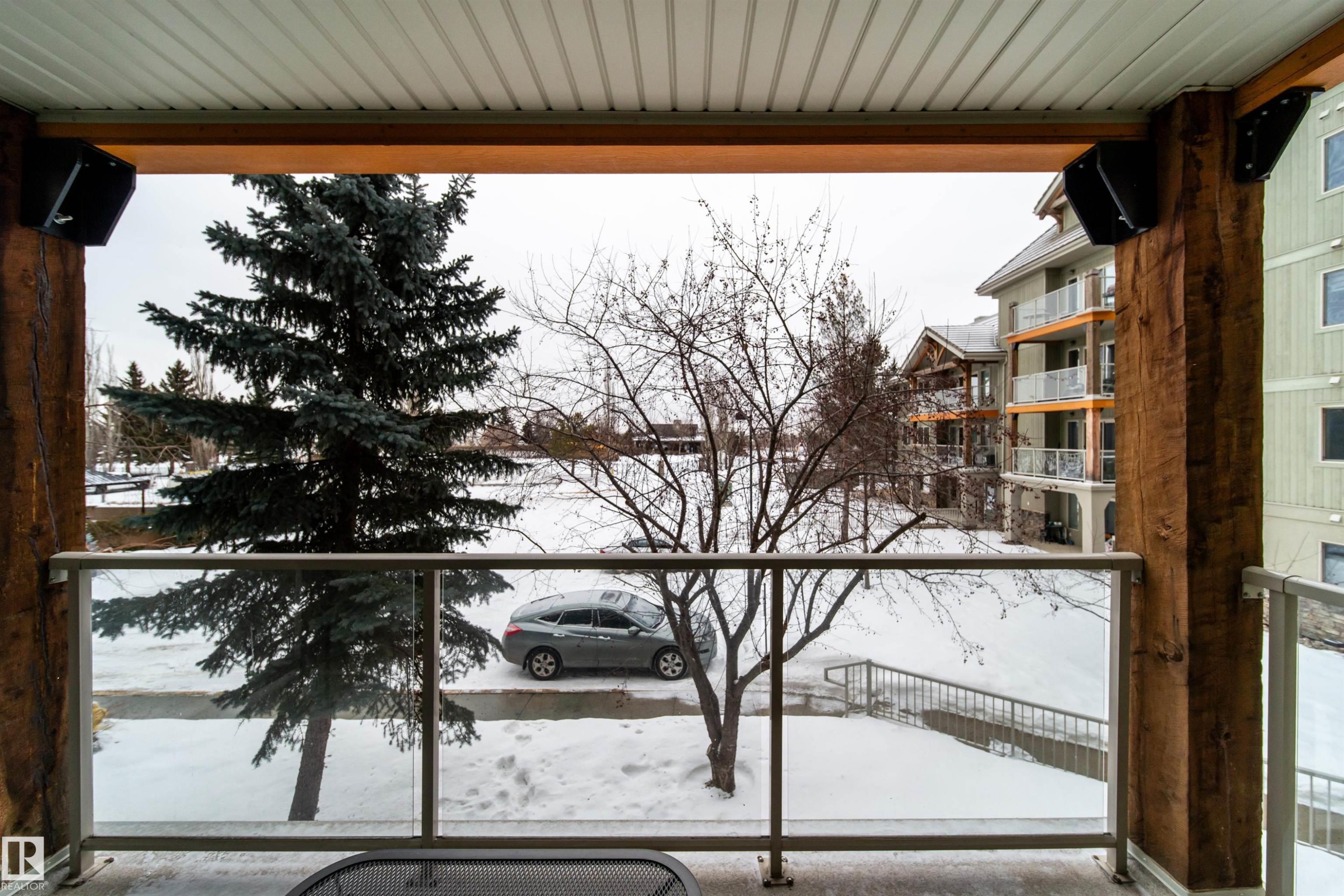 View of snow covered back of property - 237 278 Suder Greens Drive, Edmonton, AB - Indoor Photo Showing Garage