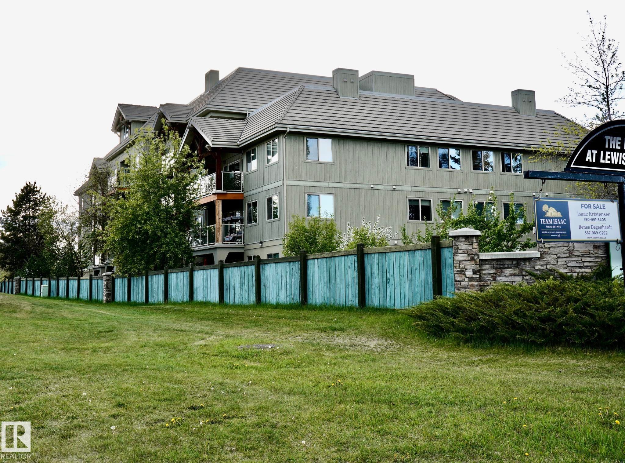 Multi-story building featuring light green siding and a dark shingle roof - 237 278 Suder Greens Drive, Edmonton, AB - Indoor Photo Showing Other Room