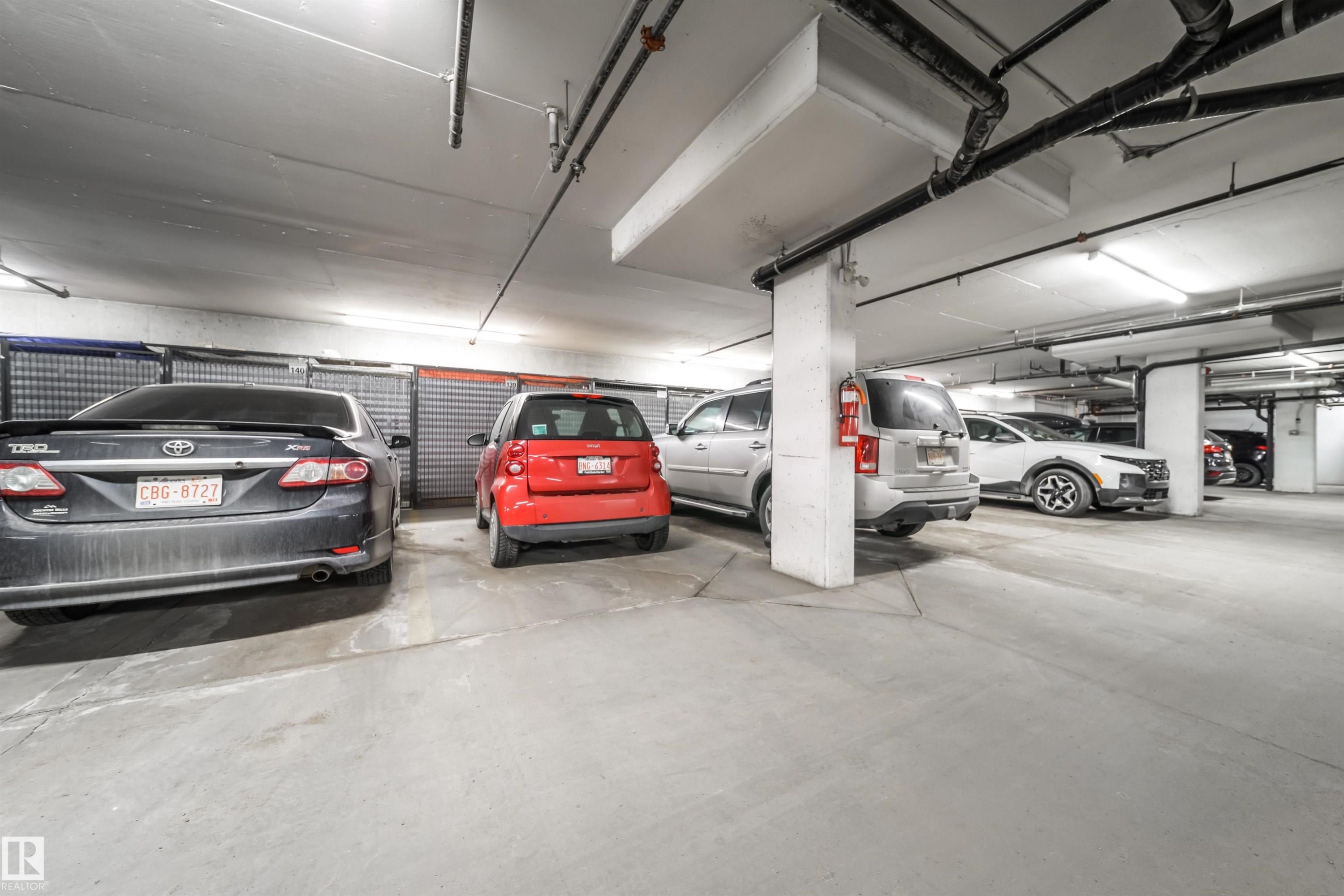 View of parking garage - 237 278 Suder Greens Drive, Edmonton, AB - Indoor Photo Showing Other Room With In Ground Pool