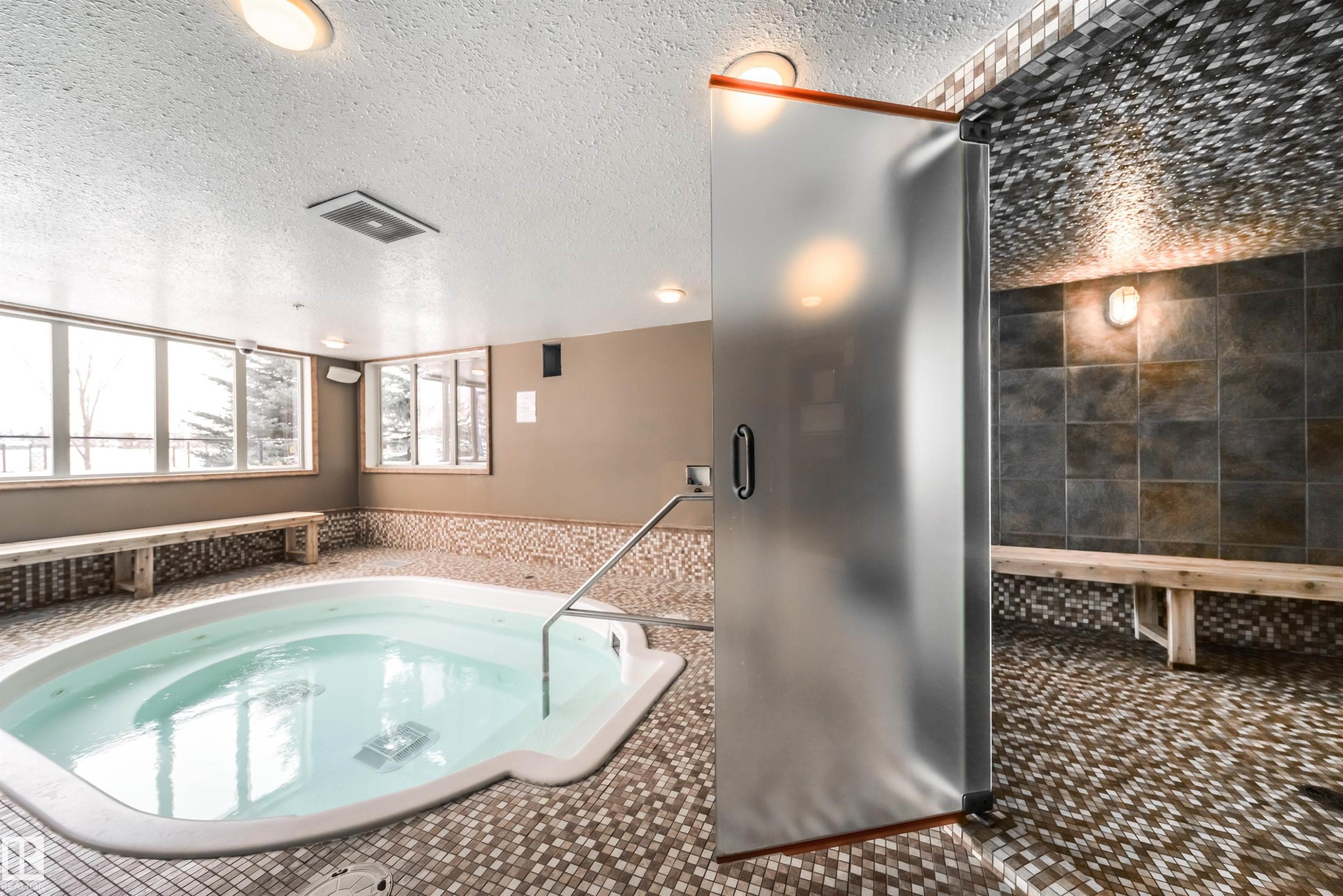 View of pool with an in-ground hot tub - 237 278 Suder Greens Drive, Edmonton, AB - Indoor Photo Showing Kitchen