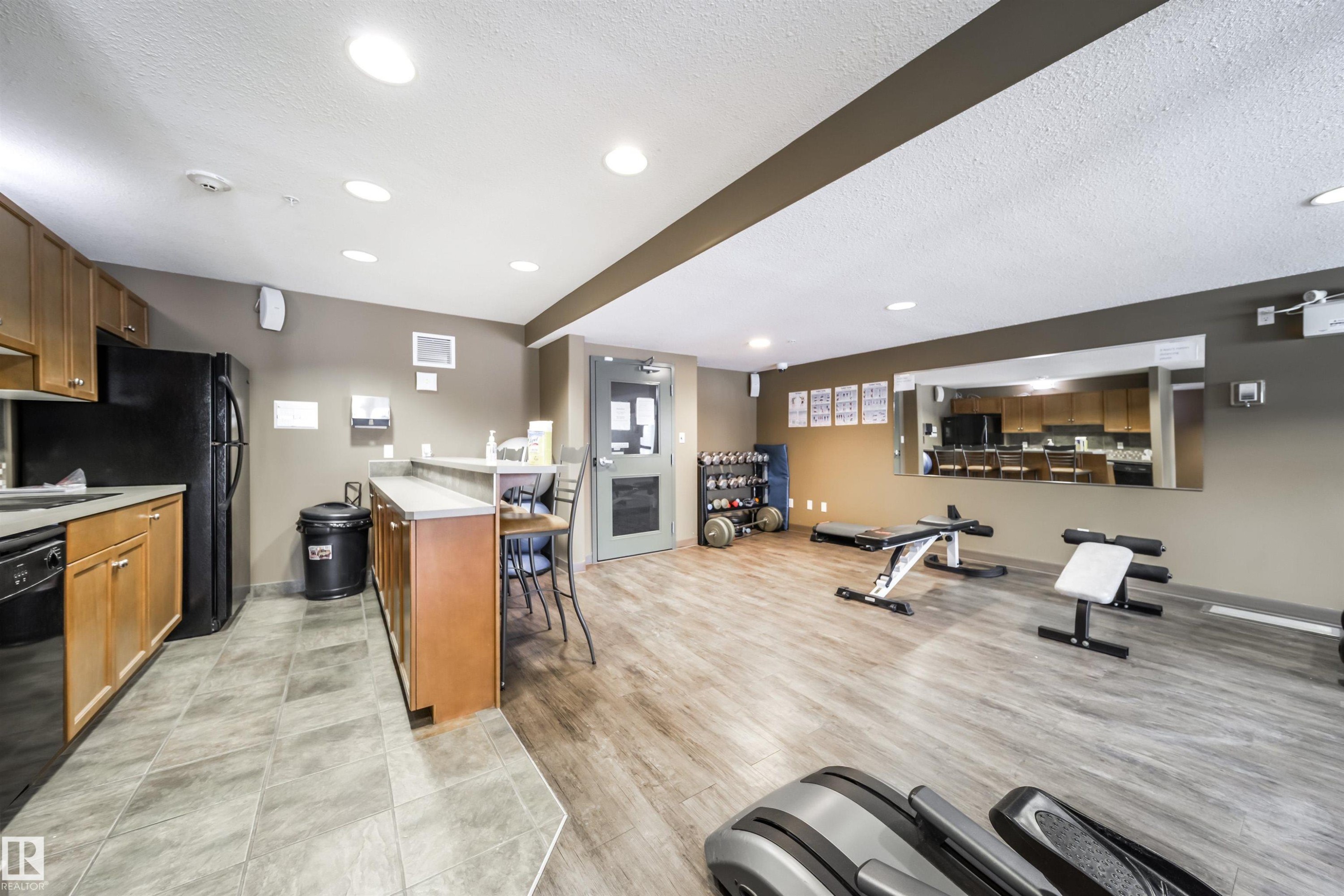 Workout room with a textured ceiling and recessed lighting - 237 278 Suder Greens Drive, Edmonton, AB - Indoor Photo Showing Other Room