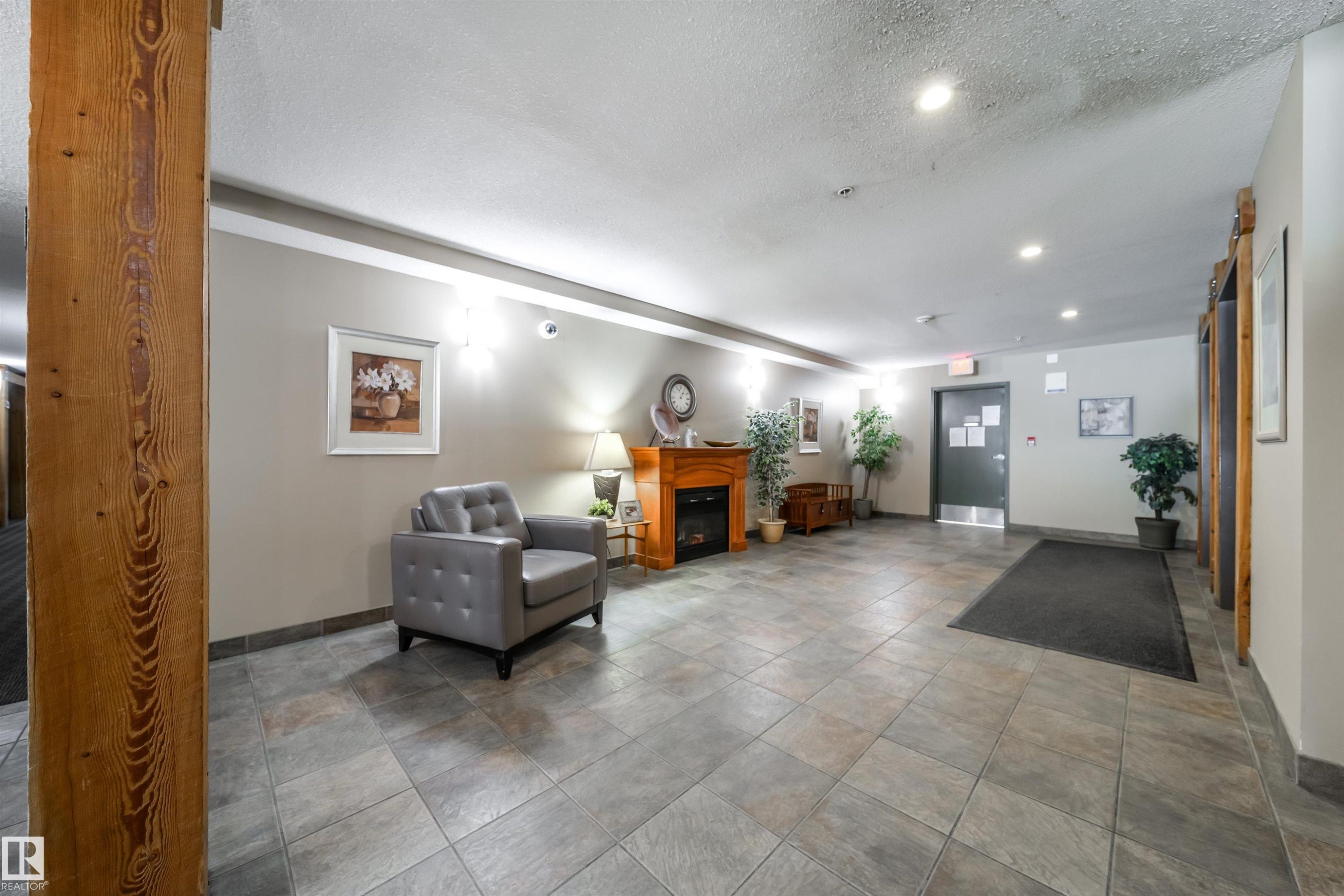 Community lobby featuring a textured ceiling and recessed lighting - 237 278 Suder Greens Drive, Edmonton, AB - Indoor Photo Showing Dining Room