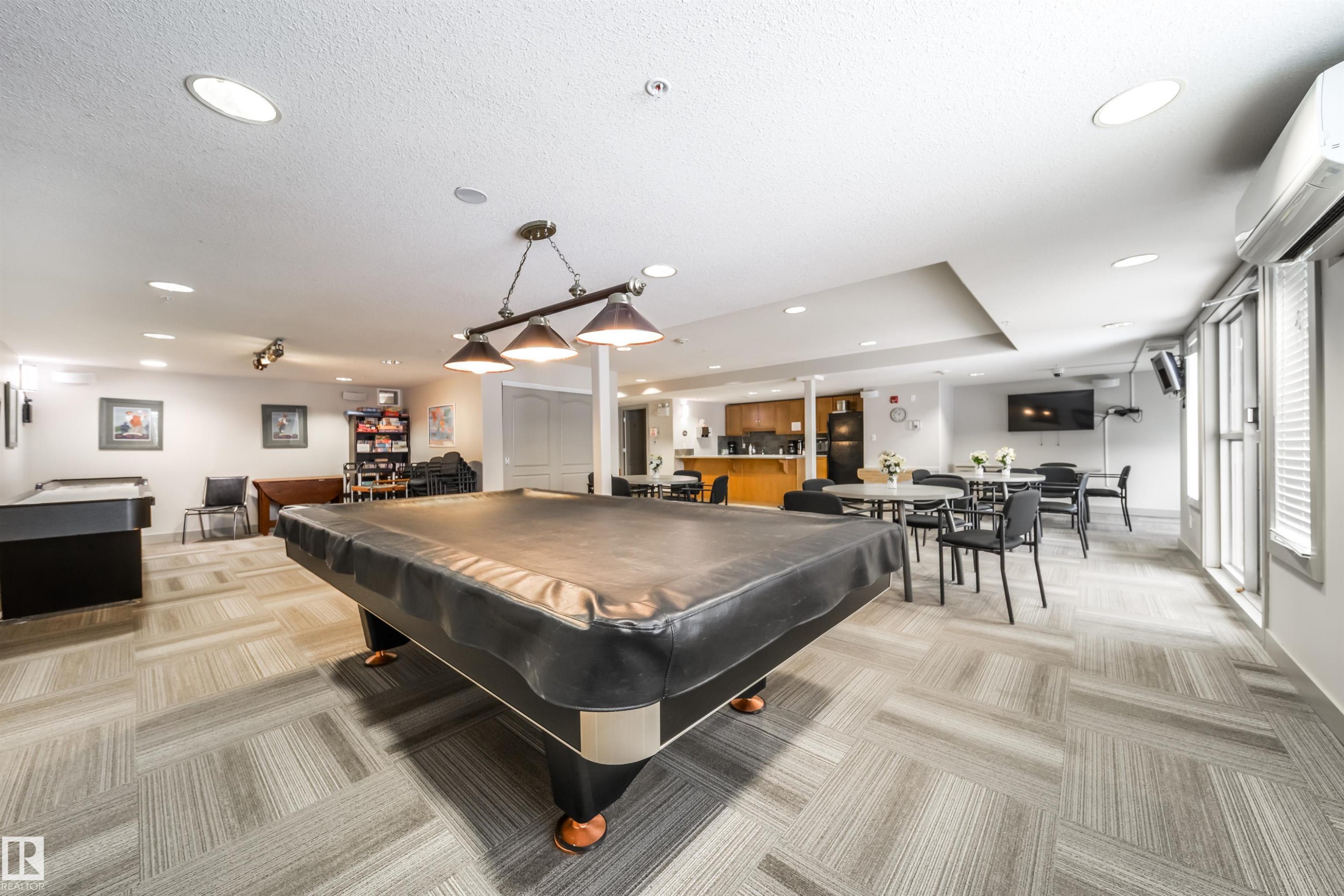 Rec room featuring recessed lighting, a wall mounted mini split, and pool table - 237 278 Suder Greens Drive, Edmonton, AB - Indoor