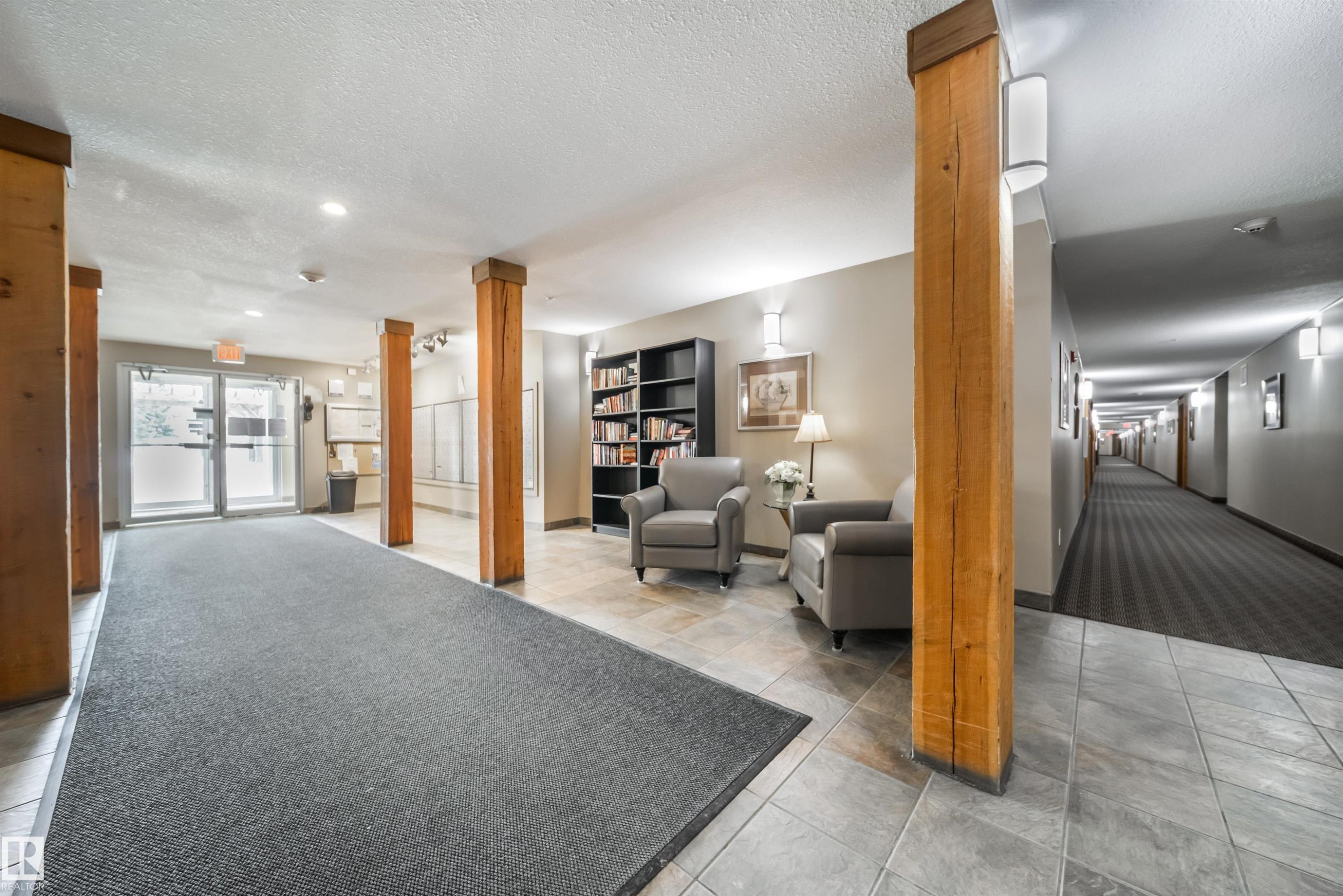 Building lobby featuring a textured ceiling - 237 278 Suder Greens Drive, Edmonton, AB - Indoor Photo Showing Other Room