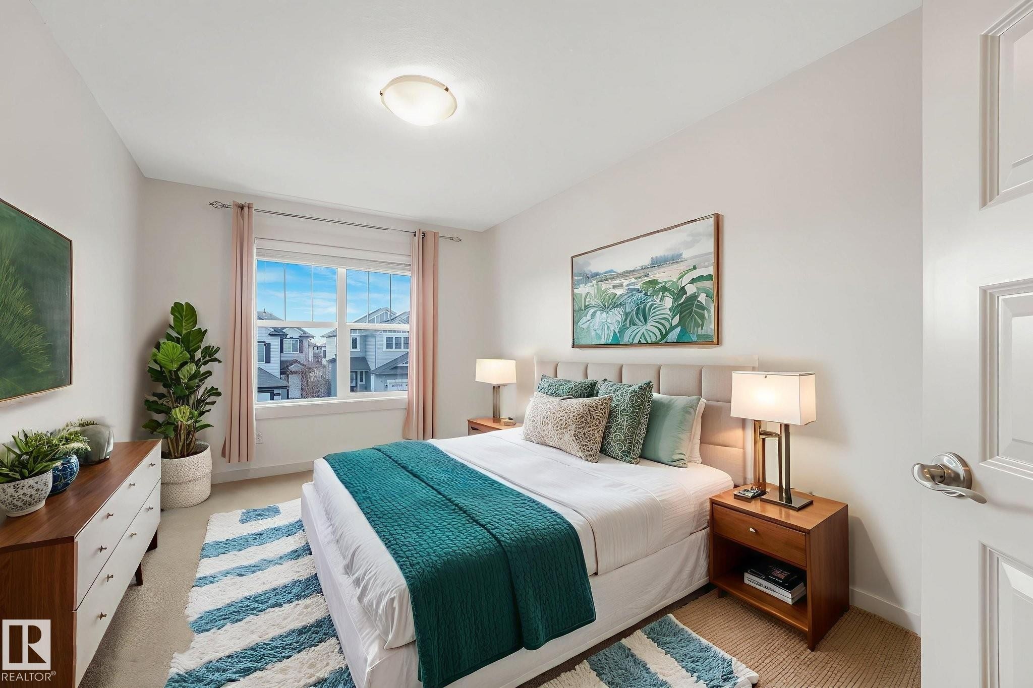 Bedroom with baseboards and light colored carpet - 1548 36 Avenue, Edmonton, AB - Indoor Photo Showing Bedroom