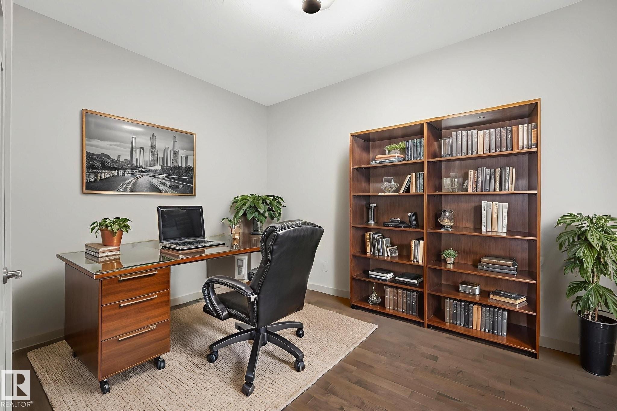 Office area featuring dark wood-style flooring and baseboards - 1548 36 Avenue, Edmonton, AB - Indoor Photo Showing Office