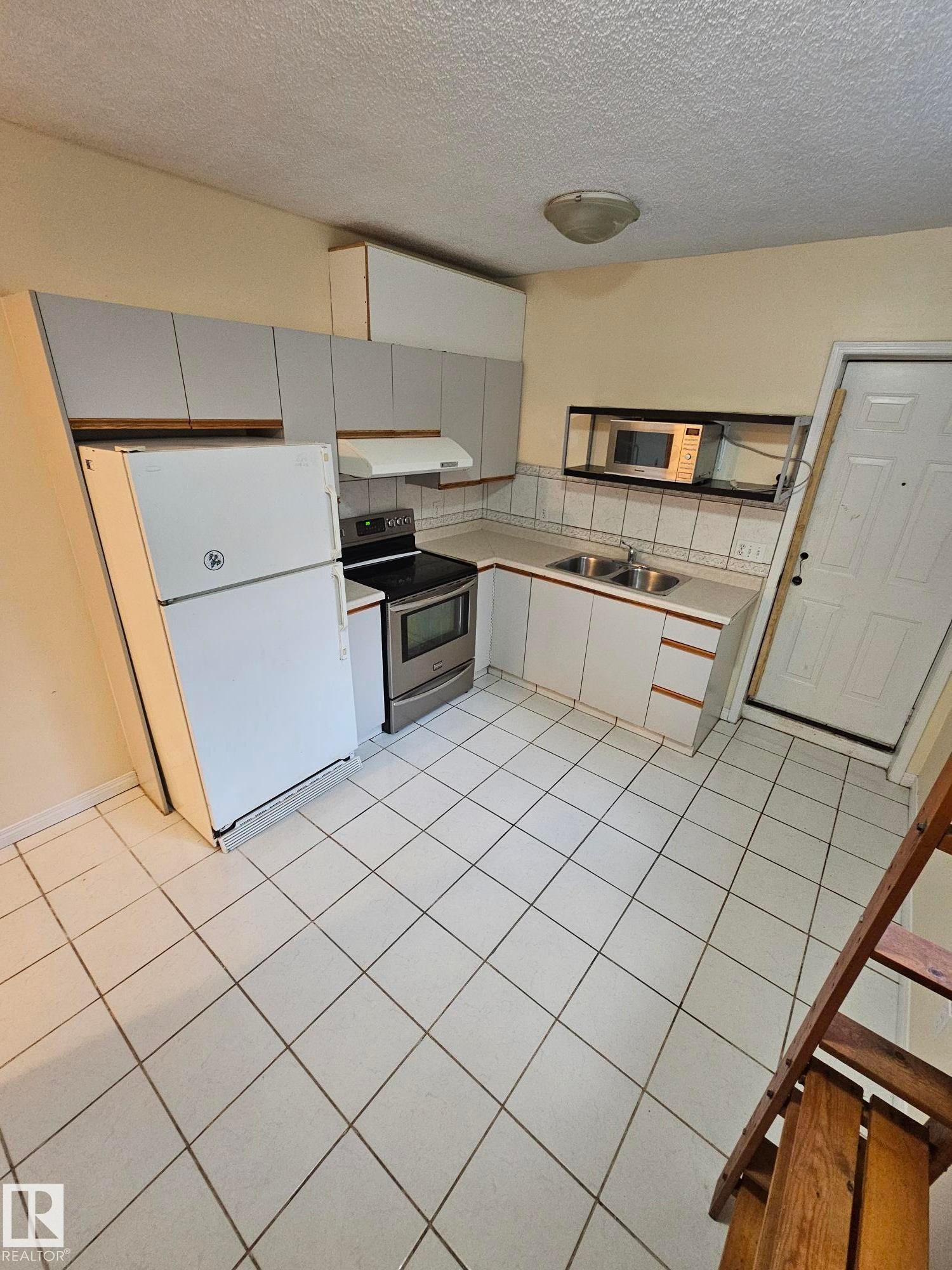 Edmonton, AB - Indoor Photo Showing Kitchen With Double Sink
