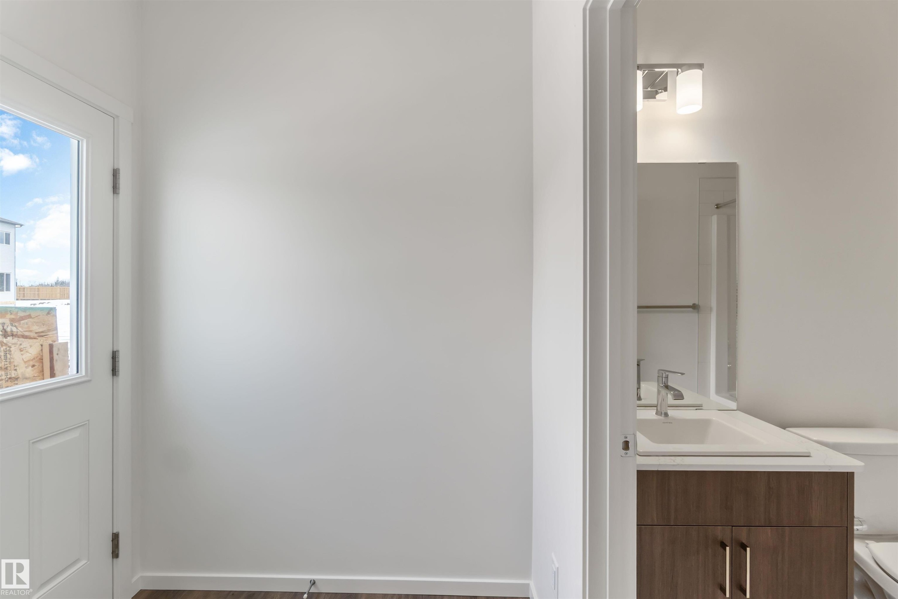 Bathroom with vanity and dark wood-type flooring - 2467 Alces Link Link, Edmonton, AB - Indoor Photo Showing Bathroom