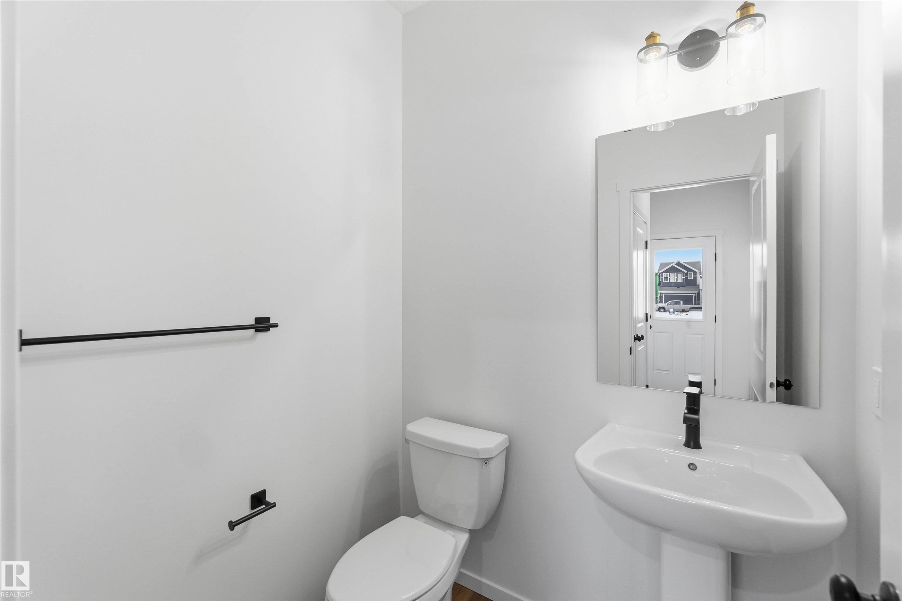Bathroom with toilet and a sink - 8652 Edgemont Link, Edmonton, AB - Indoor Photo Showing Bathroom