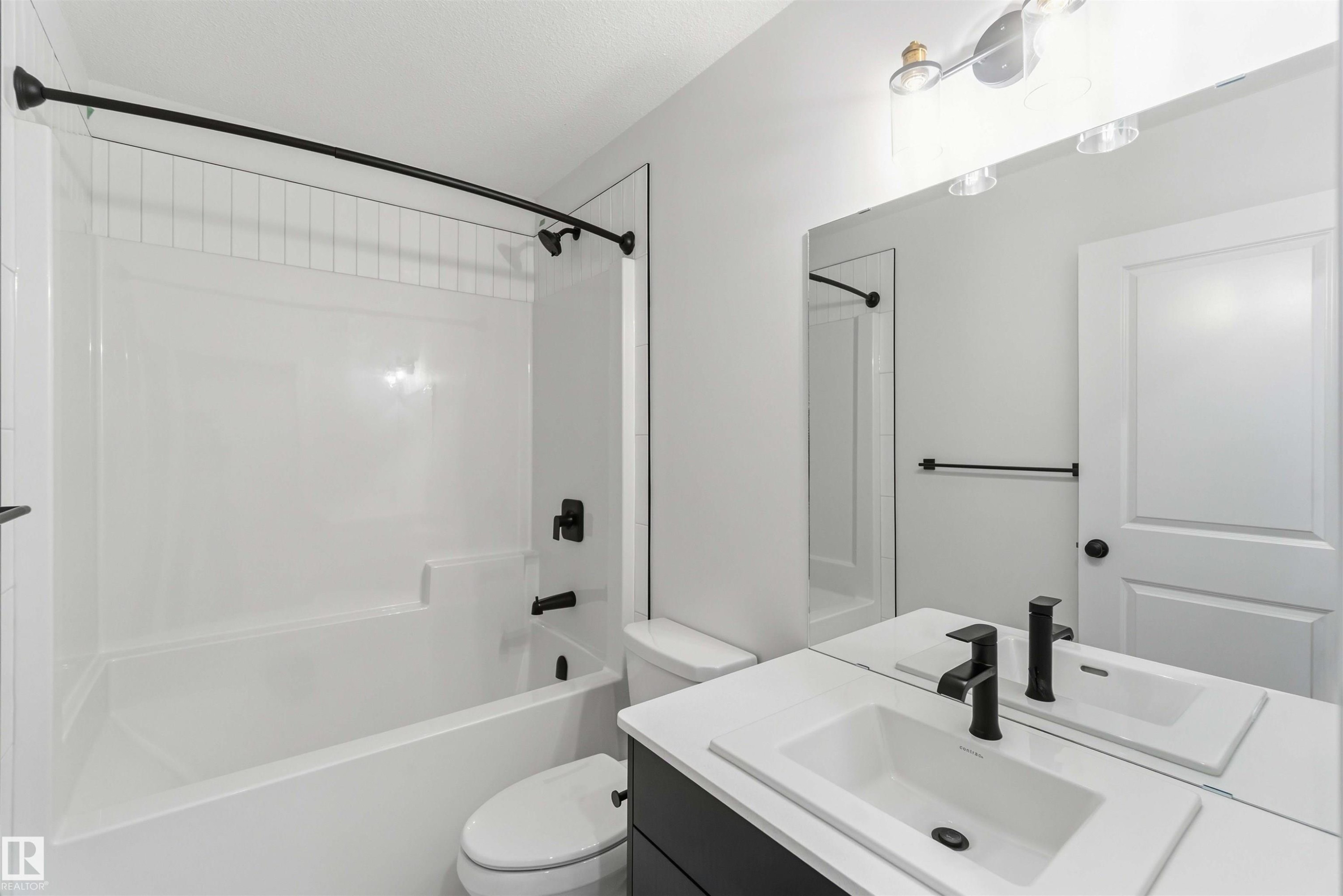 Full bath featuring vanity and washtub / shower combination - 8652 Edgemont Link, Edmonton, AB - Indoor Photo Showing Bathroom