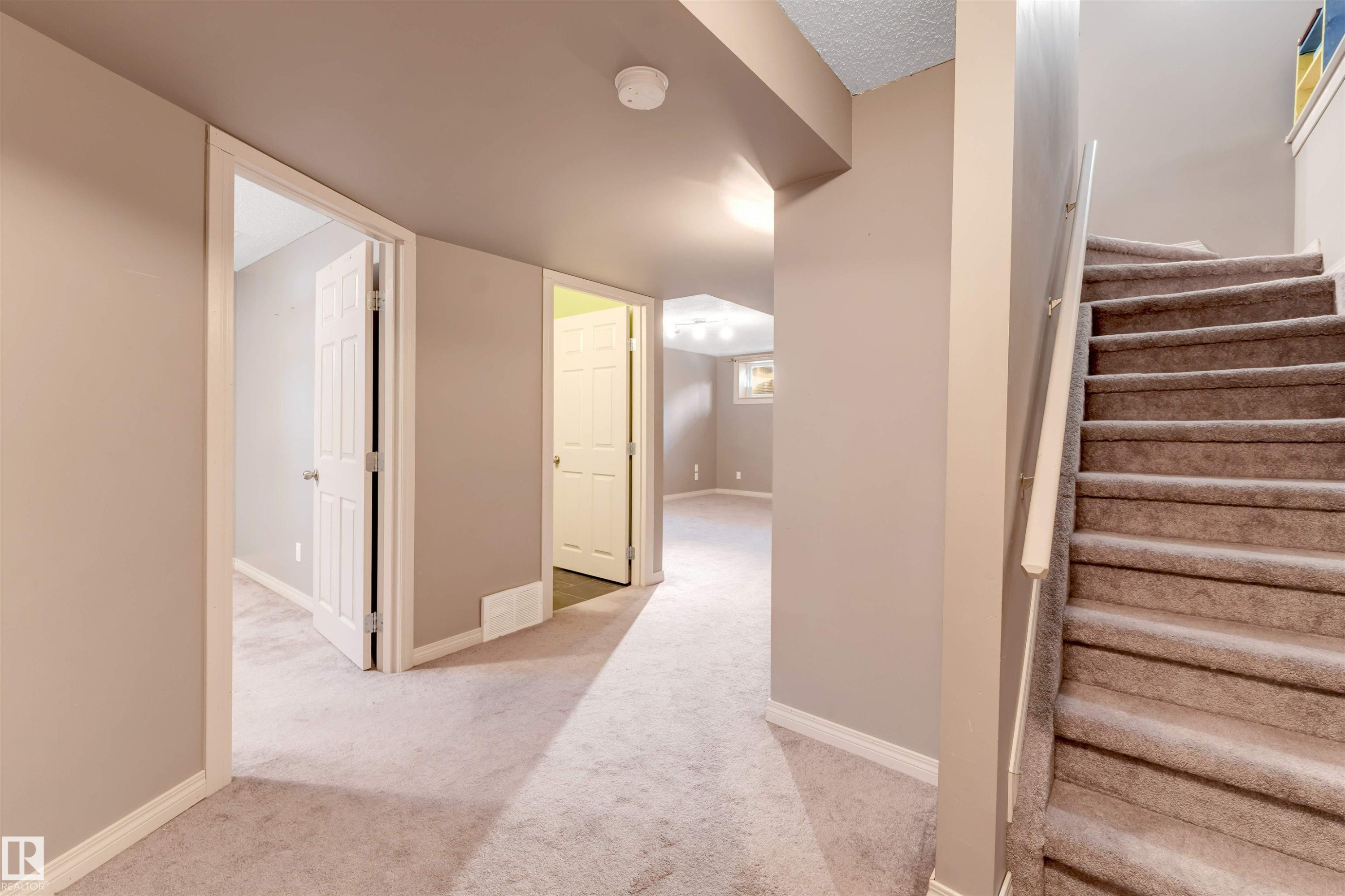 Staircase with baseboards and carpet flooring - 1157 37 Avenue, Edmonton, AB - Indoor Photo Showing Other Room