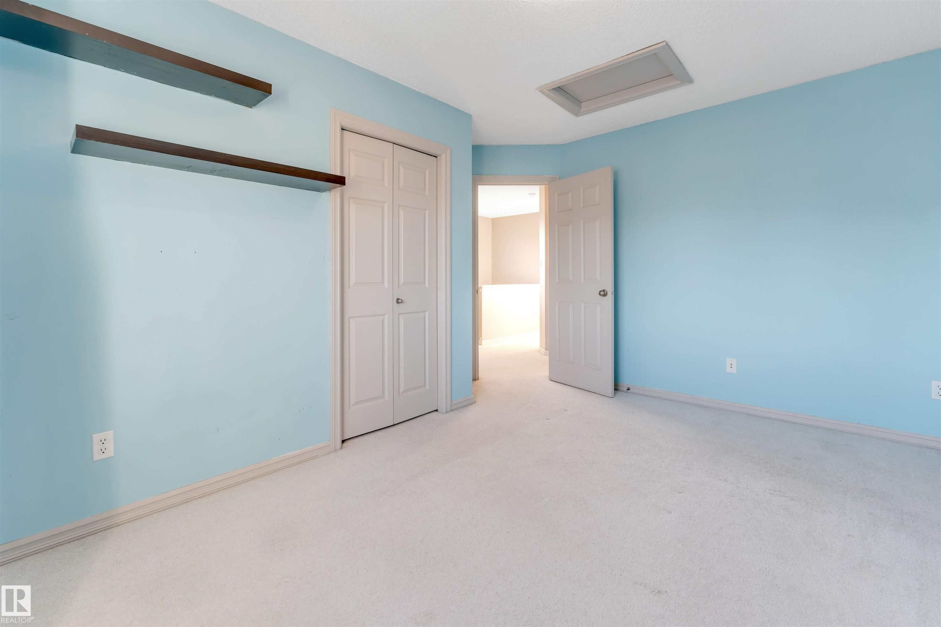 Unfurnished bedroom with light carpet and a closet - 1157 37 Avenue, Edmonton, AB - Indoor Photo Showing Other Room