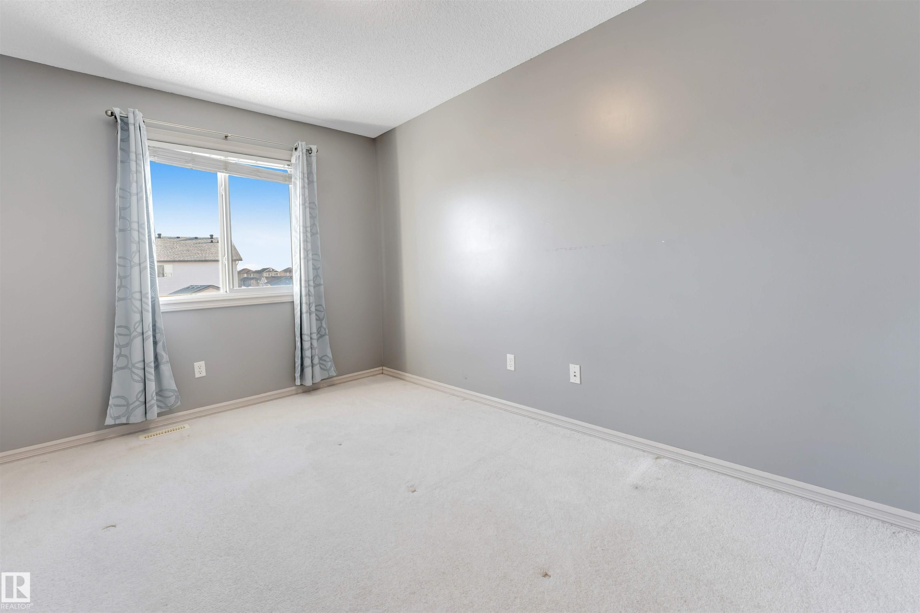 Spare room with carpet and a textured ceiling - 1157 37 Avenue, Edmonton, AB - Indoor Photo Showing Other Room
