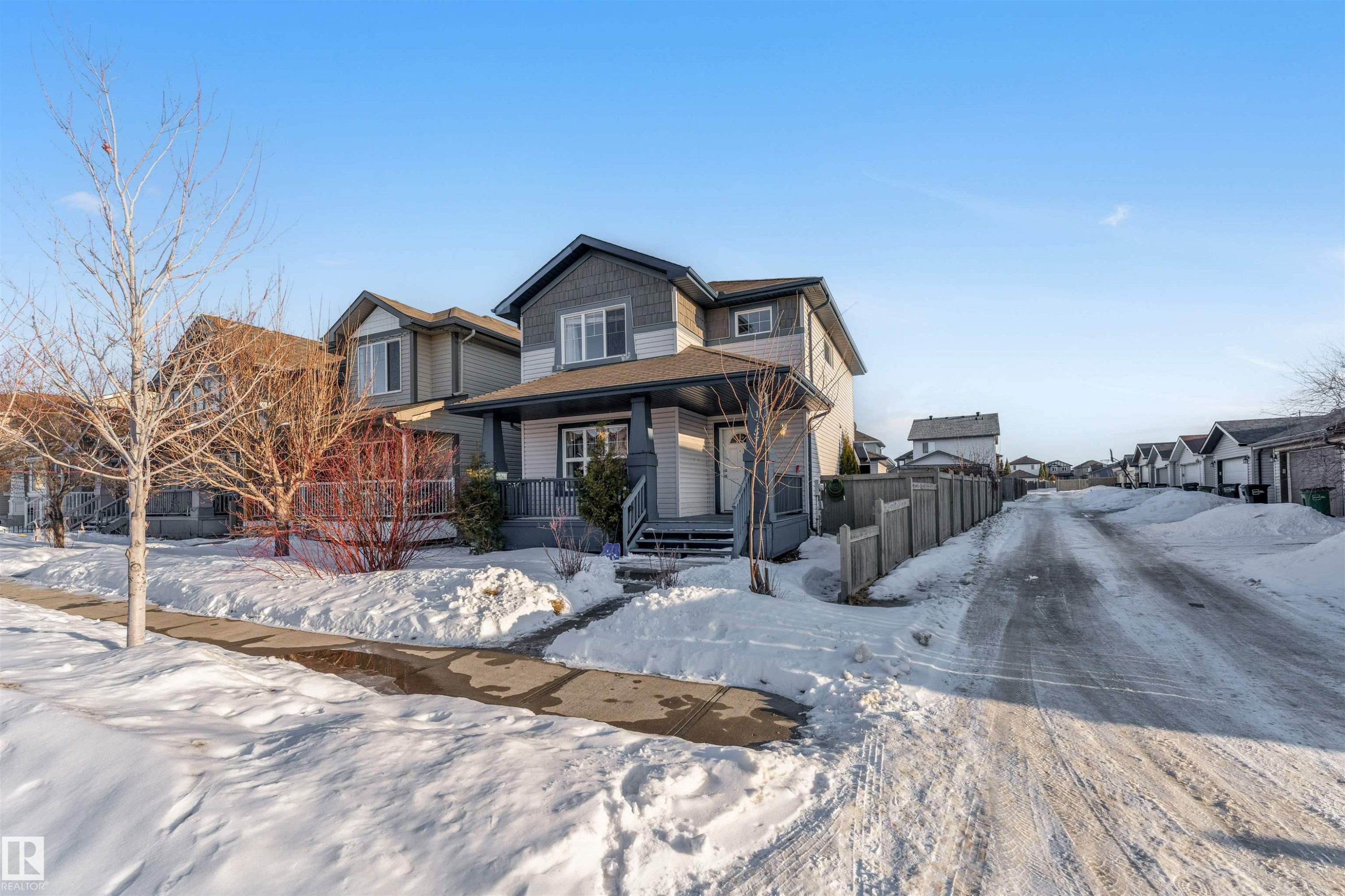 Craftsman-style home featuring a porch and a residential view - 1157 37 Avenue, Edmonton, AB - Outdoor With Facade