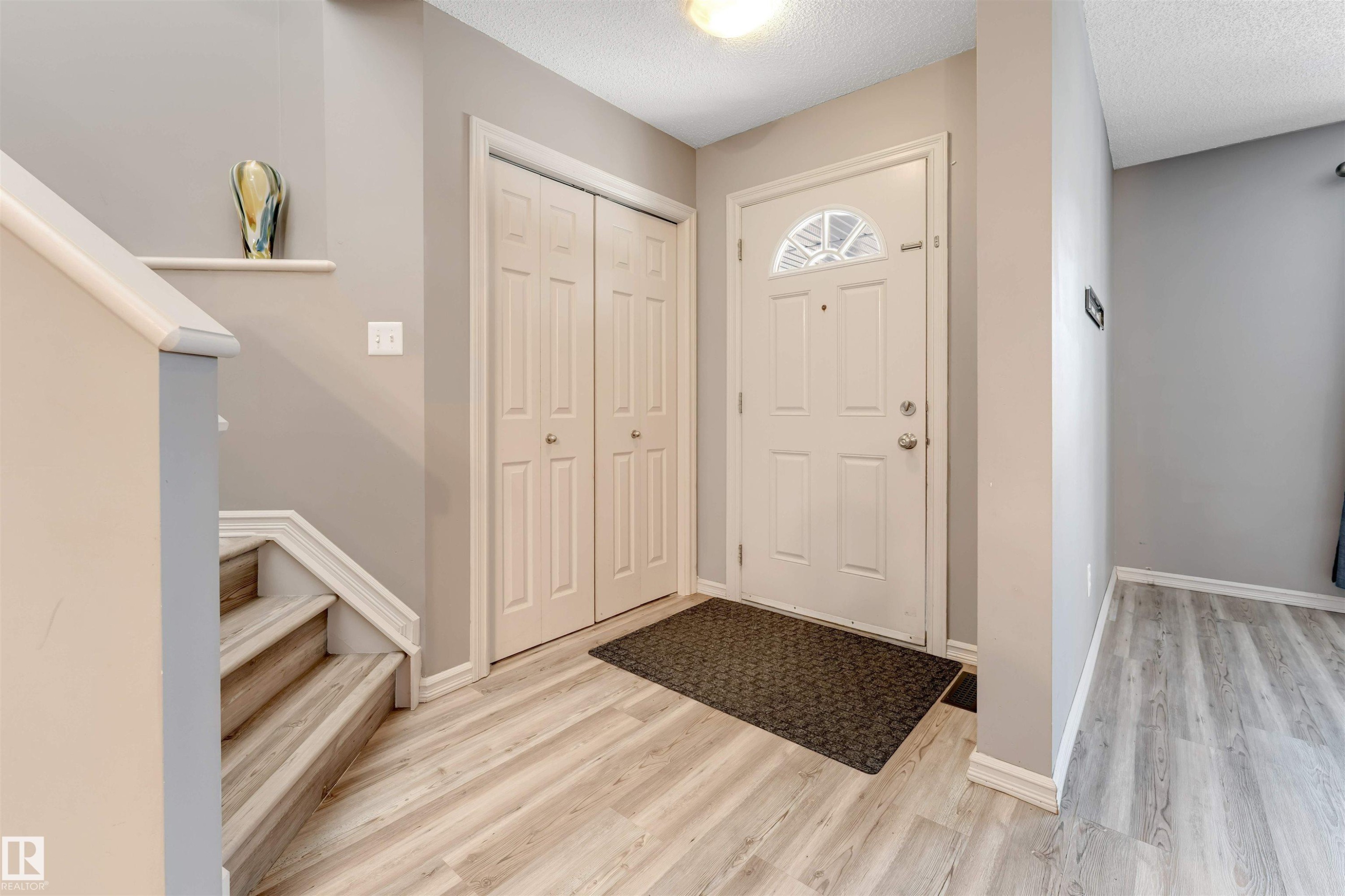 Foyer featuring light wood finished floors and a textured ceiling - 1157 37 Avenue, Edmonton, AB - Indoor Photo Showing Other Room