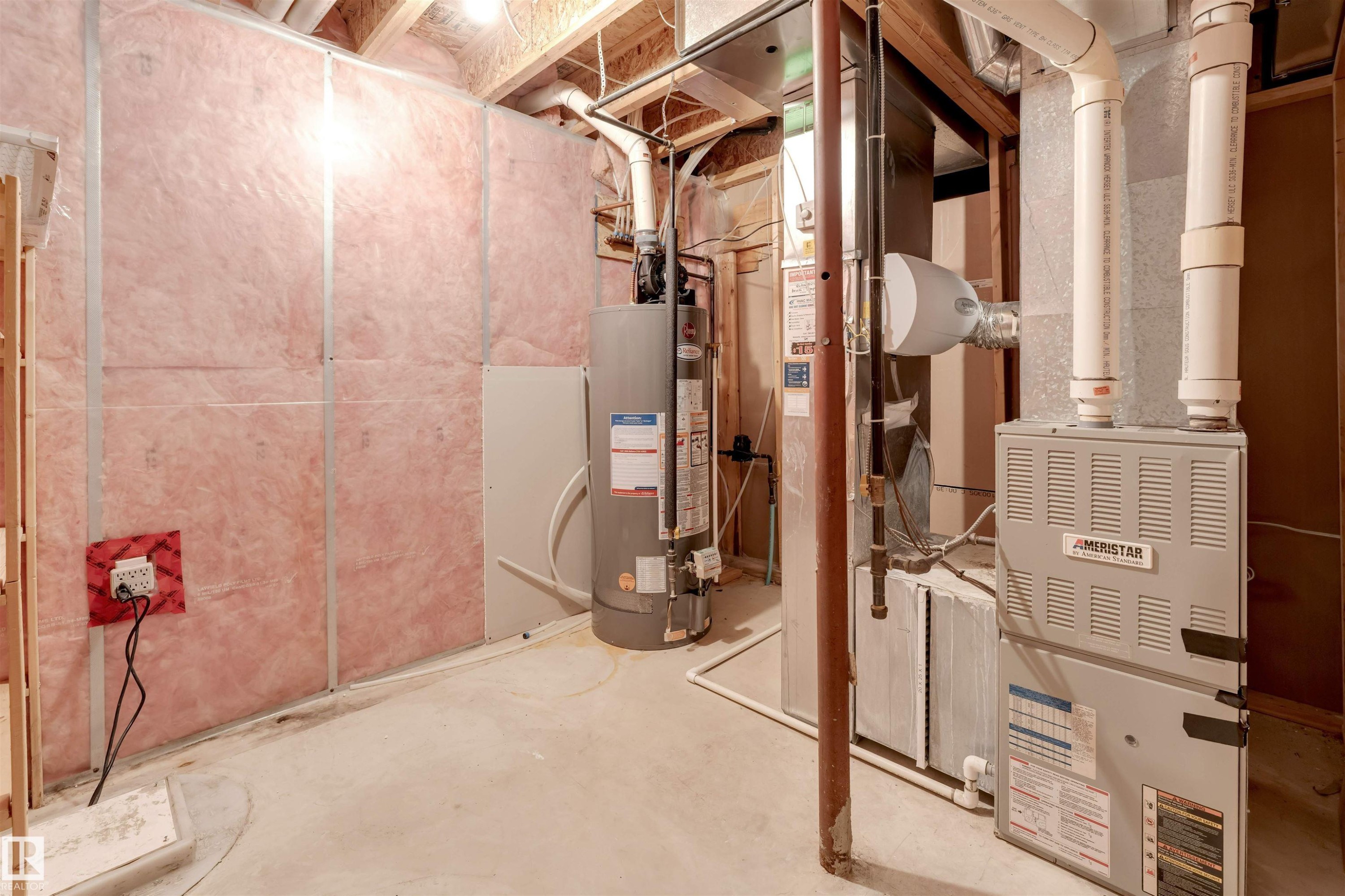 Utility room featuring gas water heater - 1157 37 Avenue, Edmonton, AB - Indoor Photo Showing Basement