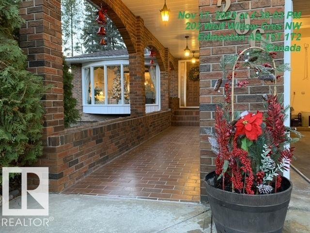 Doorway to property with brick siding and covered porch - 206 Wolf Willow Crescent, Edmonton, AB - Outdoor