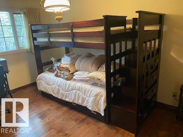 Bedroom featuring dark wood-style flooring - 206 Wolf Willow Crescent, Edmonton, AB - Indoor Photo Showing Bedroom