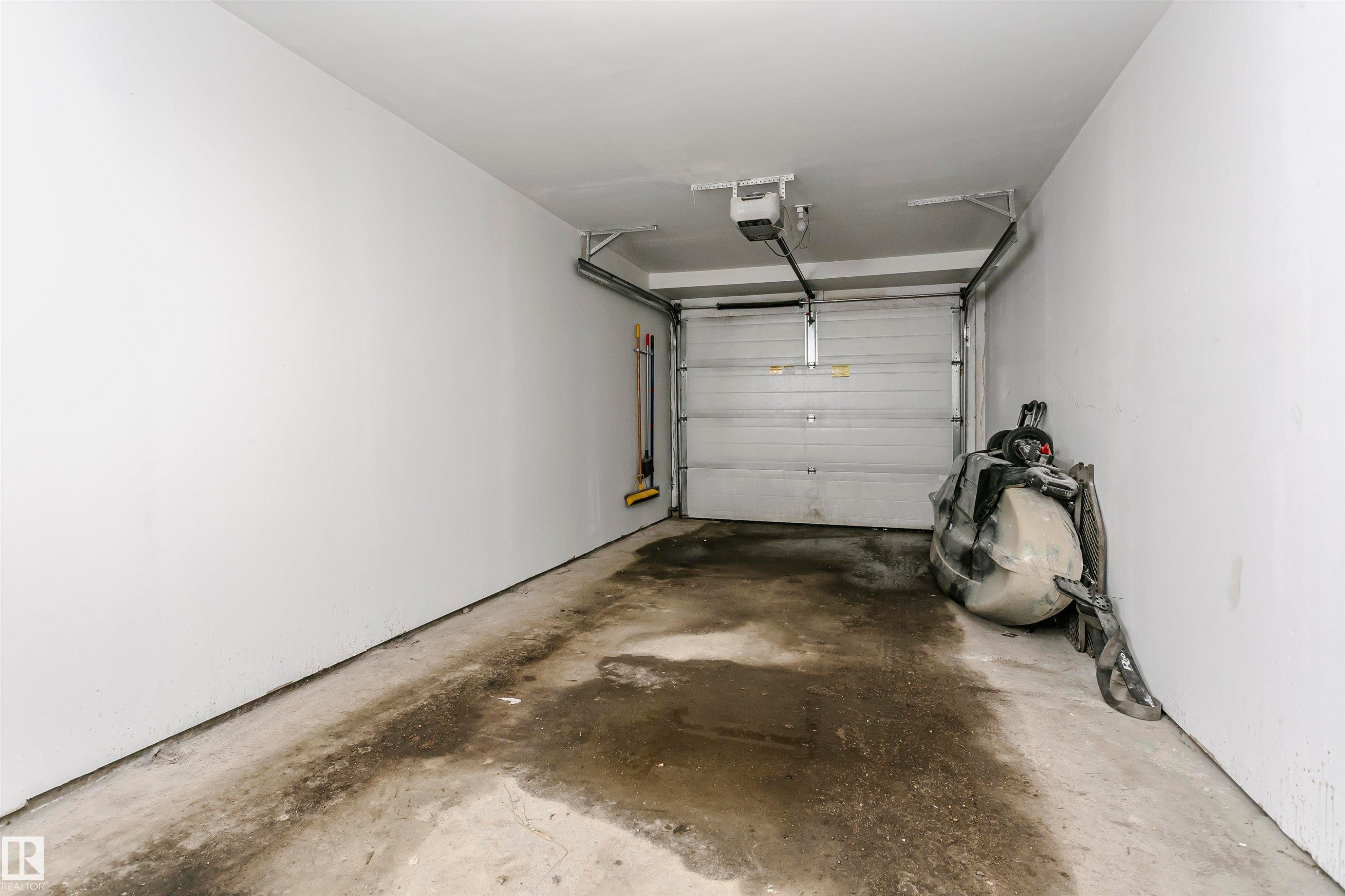 Tandem Garage - 4011 Orchards Drive, Edmonton, AB - Indoor Photo Showing Garage