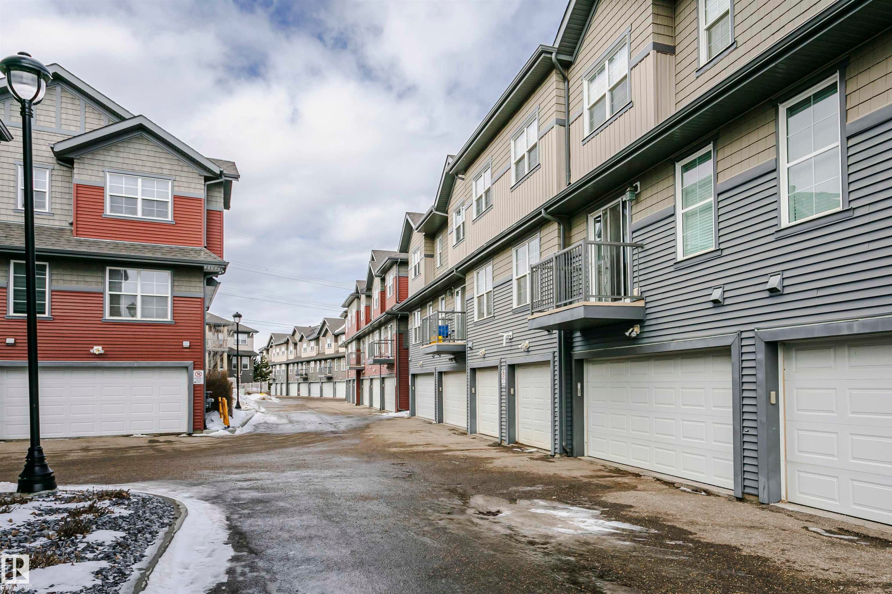 View of asphalt road with a residential view - 4011 Orchards Drive, Edmonton, AB - Outdoor