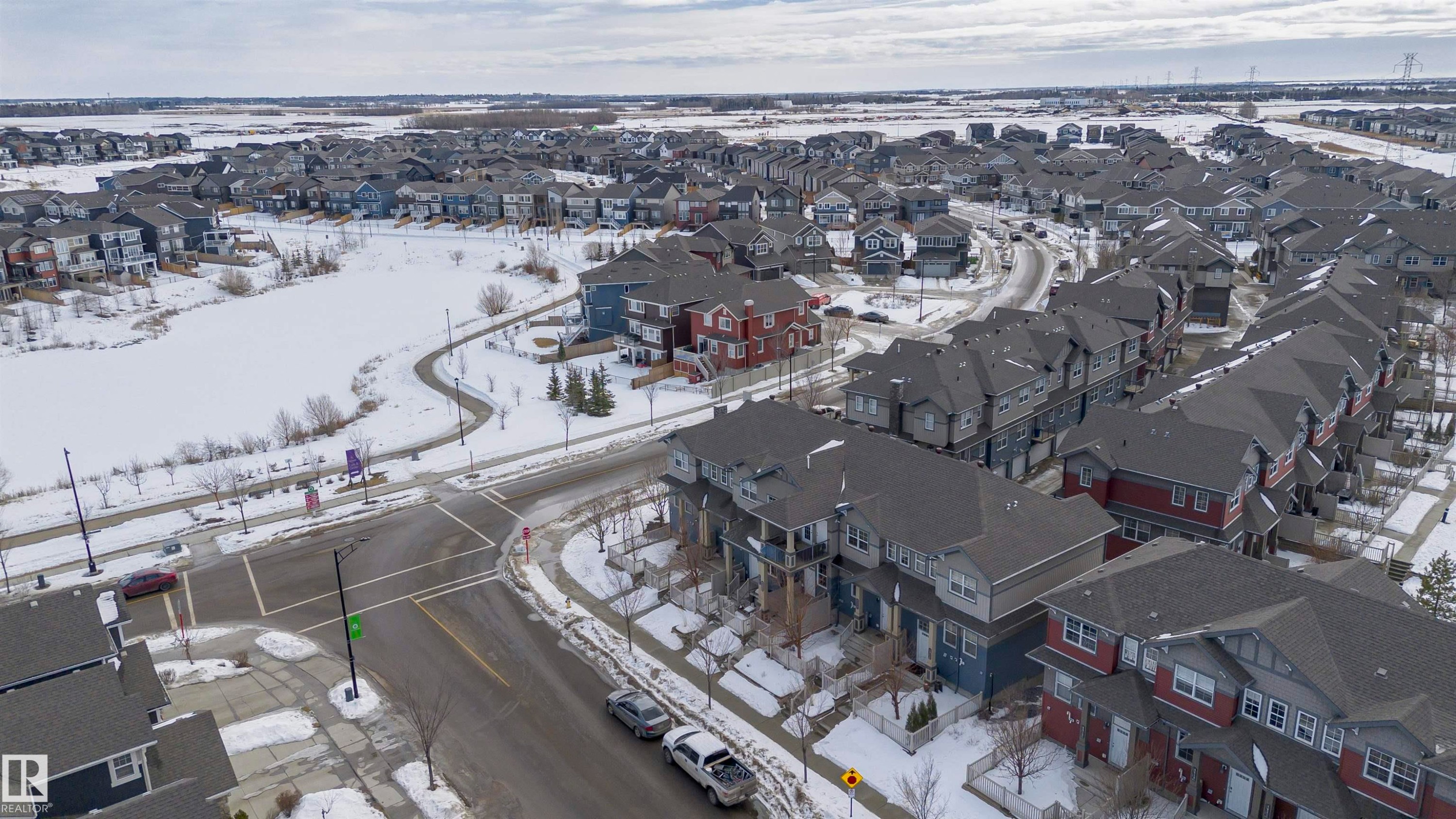 Snowy aerial view featuring a residential view - 4011 Orchards Drive, Edmonton, AB - Outdoor With View