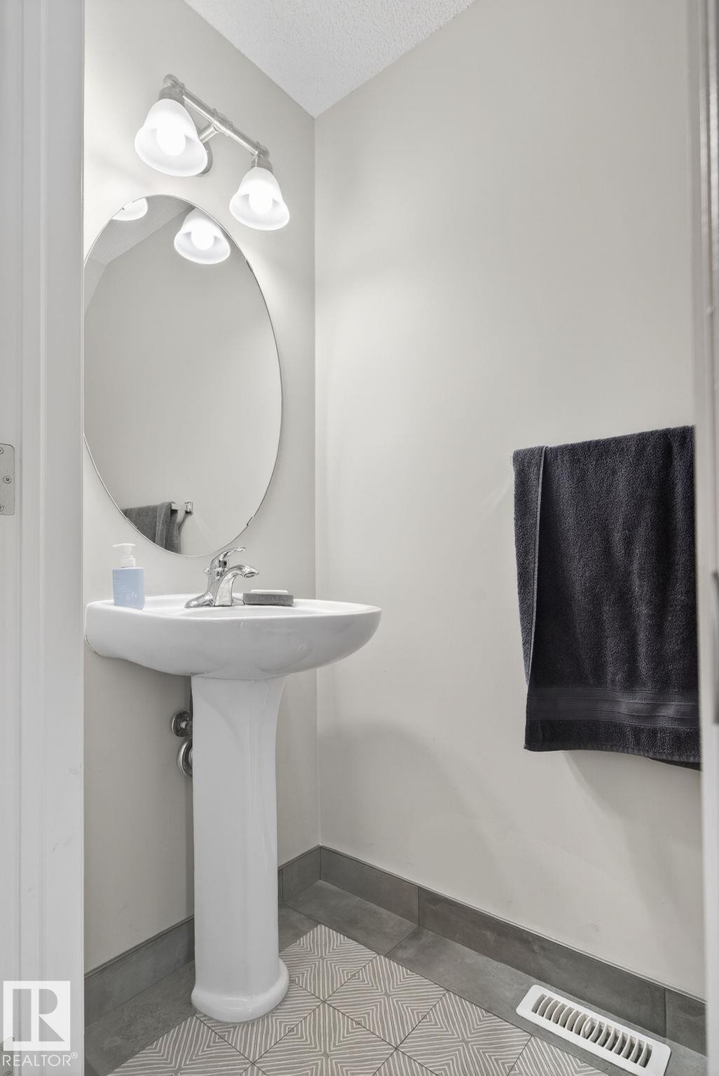 Bathroom featuring a textured ceiling and light tile patterned flooring - 60 1804 70 Street, Edmonton, AB - Indoor Photo Showing Other Room