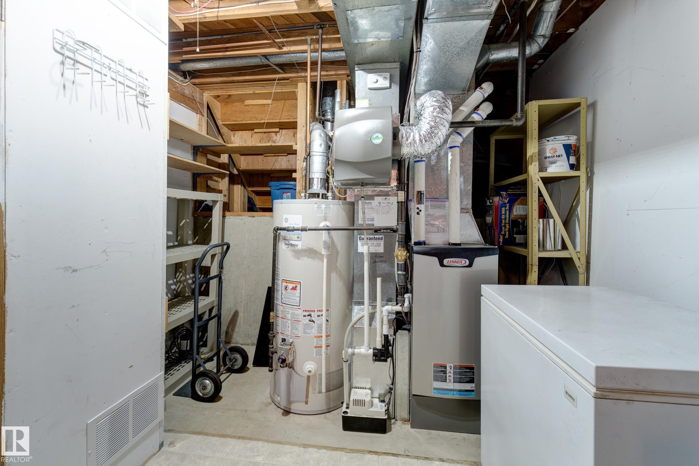 Utilities with water heater and heating unit - 4823 10 Avenue, Edmonton, AB - Indoor Photo Showing Basement