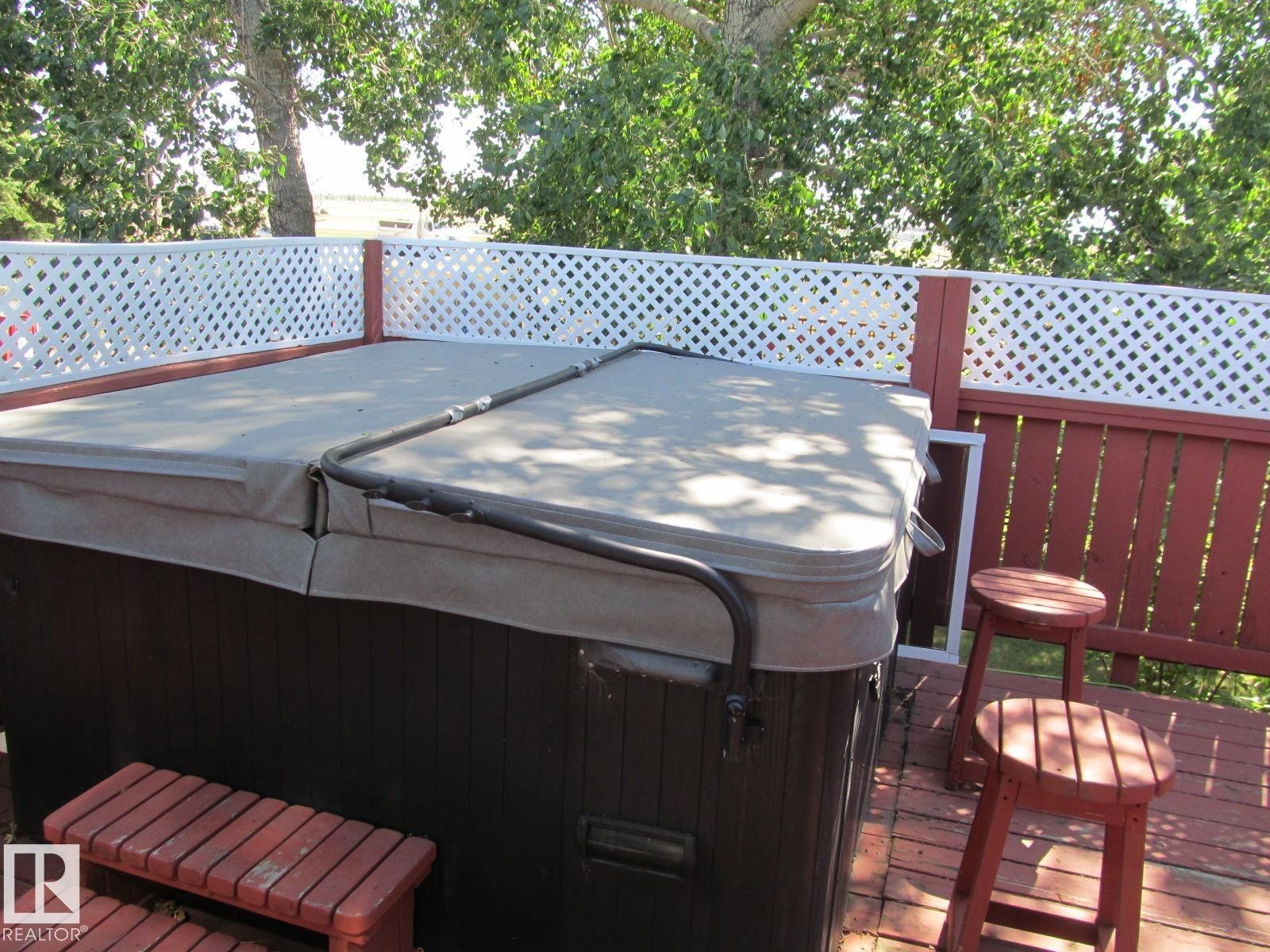 Deck featuring a hot tub - 4823 10 Avenue, Edmonton, AB - Outdoor With Deck Patio Veranda