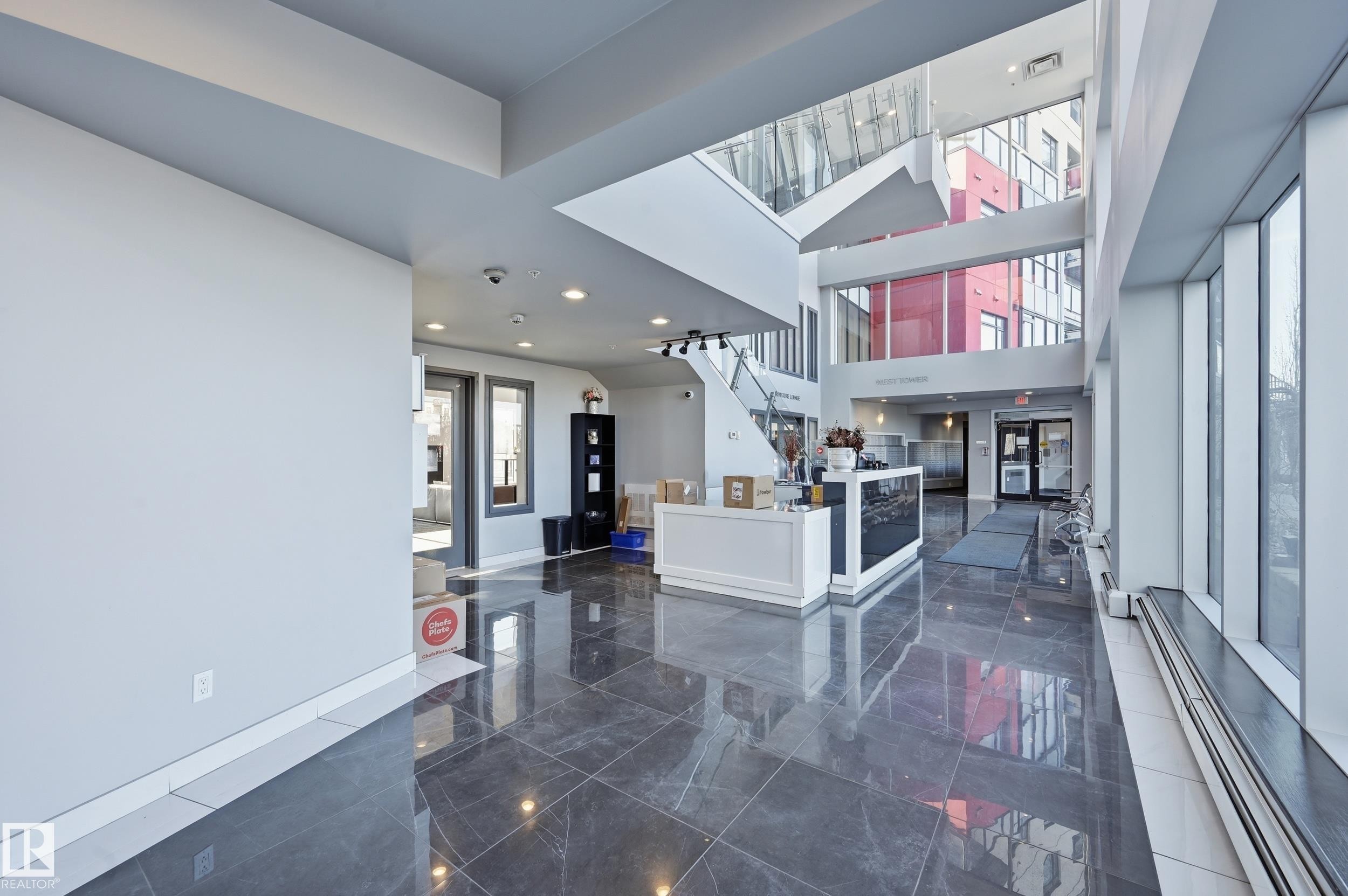 Entryway with baseboard heating, a high ceiling, and recessed lighting - 511 5151 Windermere Boulevard, Edmonton, AB - Indoor Photo Showing Other Room