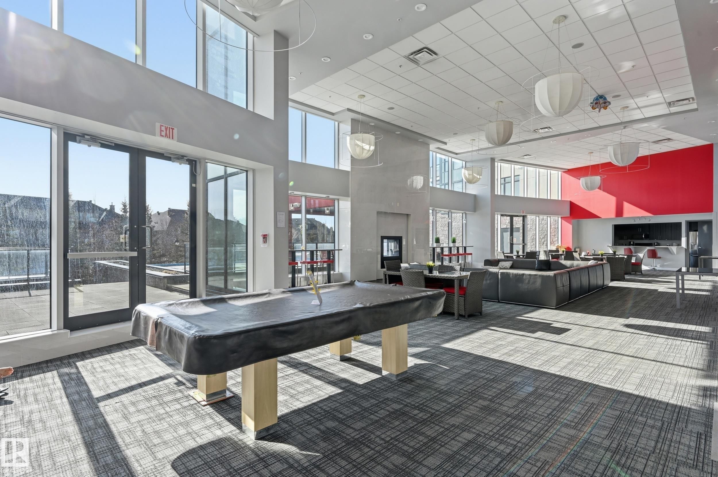 Rec room featuring pool table, a high ceiling, and healthy amount of natural light - 511 5151 Windermere Boulevard, Edmonton, AB - Indoor Photo Showing Other Room
