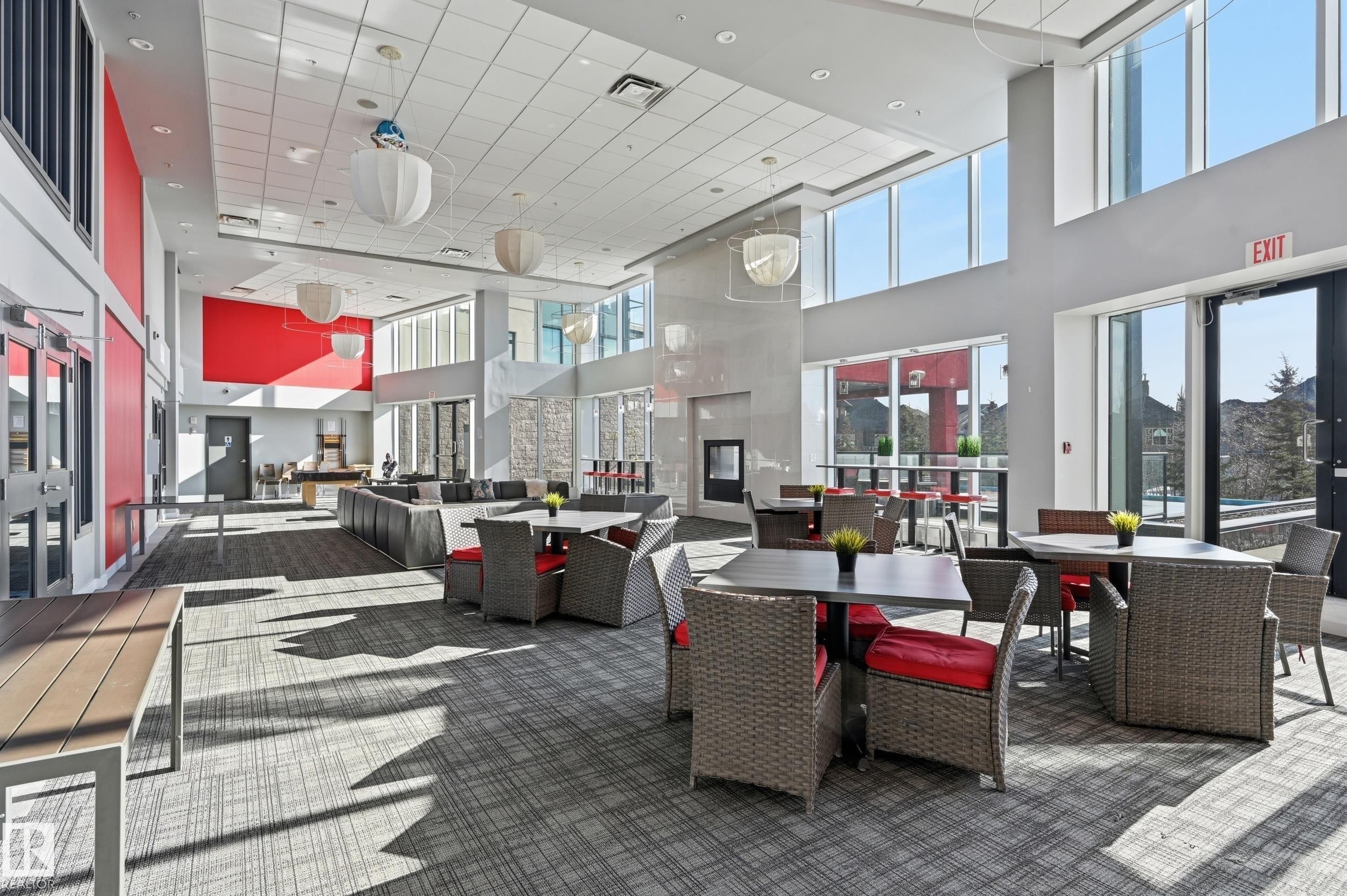 Building lobby with a high ceiling and recessed lighting - 511 5151 Windermere Boulevard, Edmonton, AB - Indoor