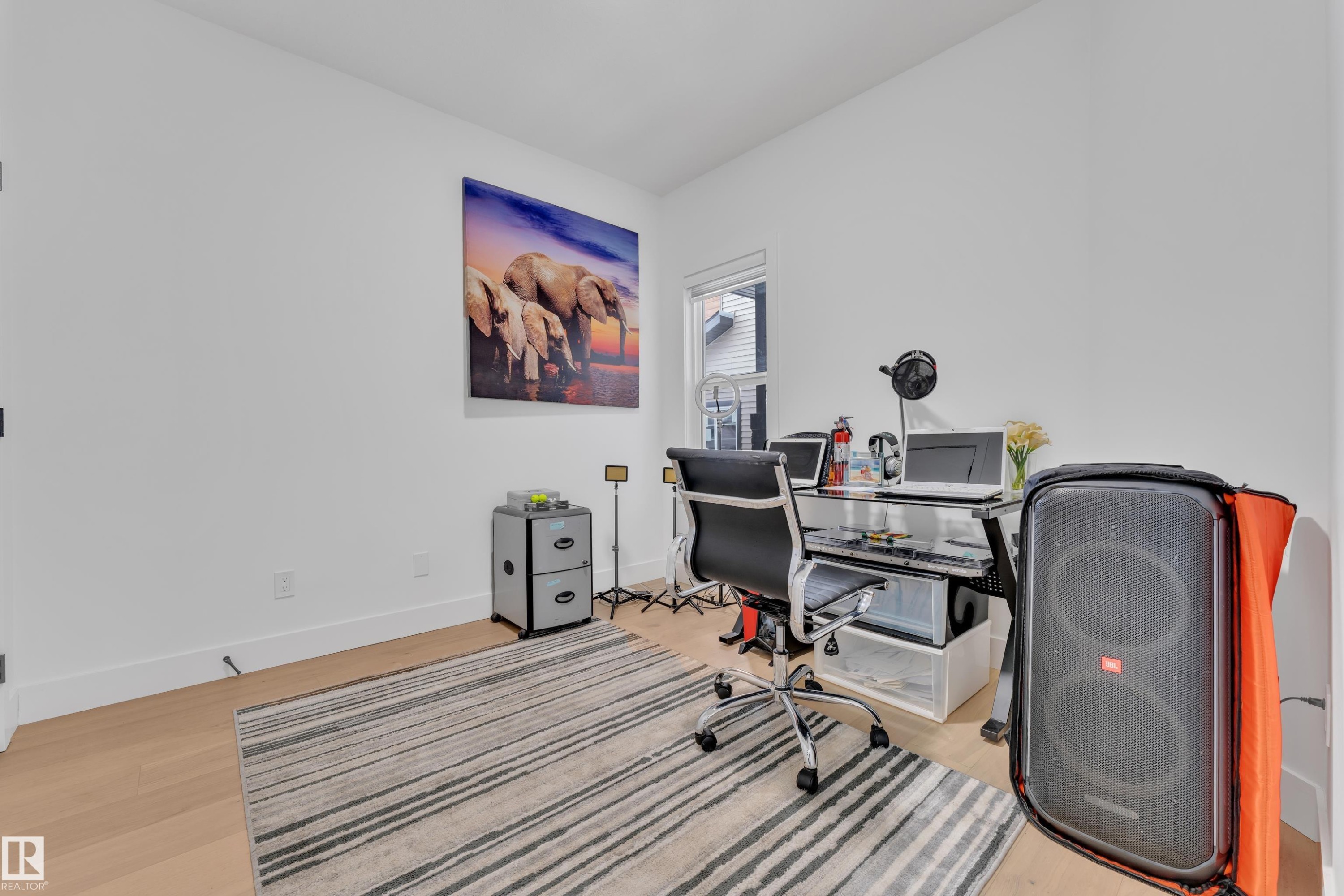 Office space with light wood-type flooring and baseboards - 16812 48 Street Nw, Edmonton, AB - Indoor Photo Showing Office