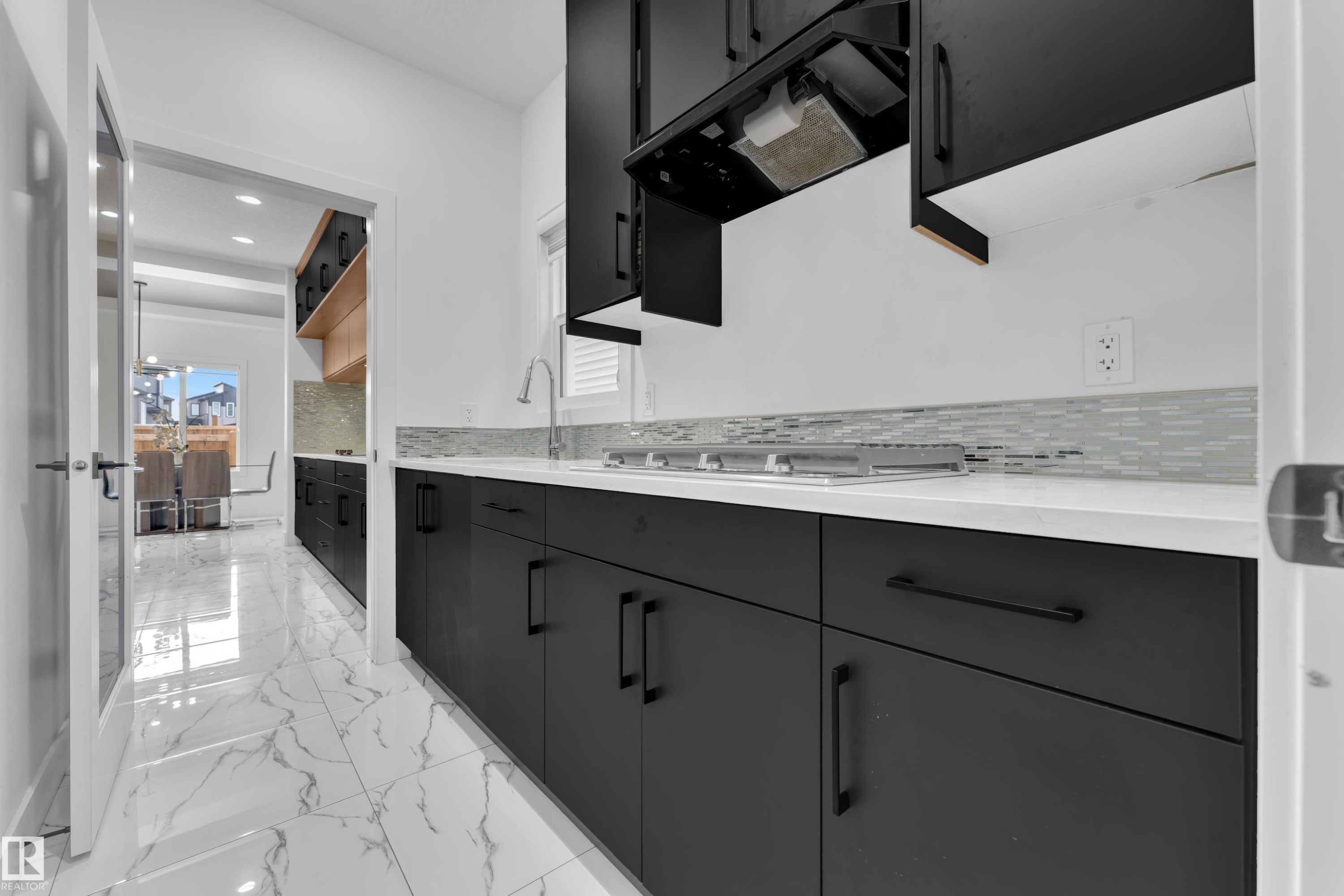 Bathroom with vanity, light marble finish flooring, tasteful backsplash, and recessed lighting - 16812 48 Street Nw, Edmonton, AB - Indoor Photo Showing Bathroom