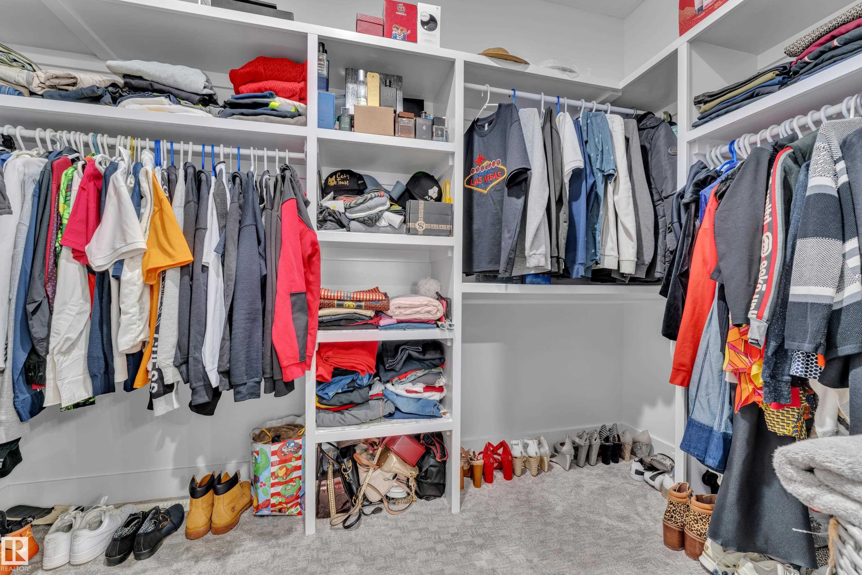Walk in closet featuring carpet - 16812 48 Street Nw, Edmonton, AB - Indoor With Storage