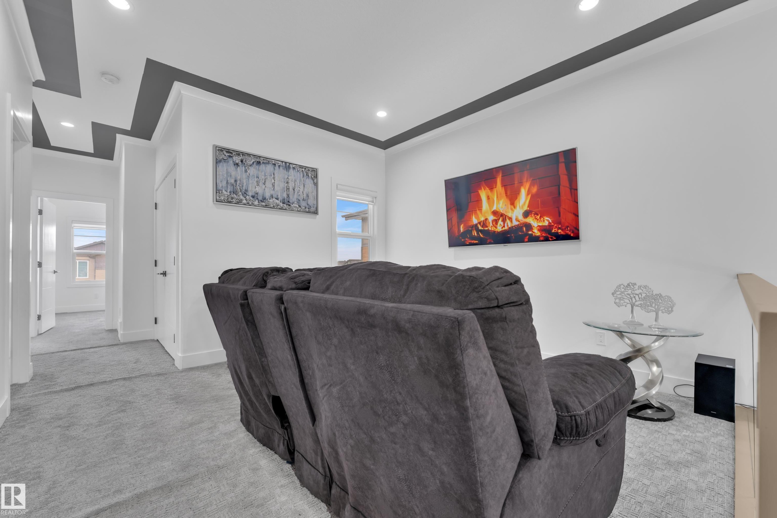 Living room featuring light carpet and recessed lighting - 16812 48 Street Nw, Edmonton, AB - Indoor
