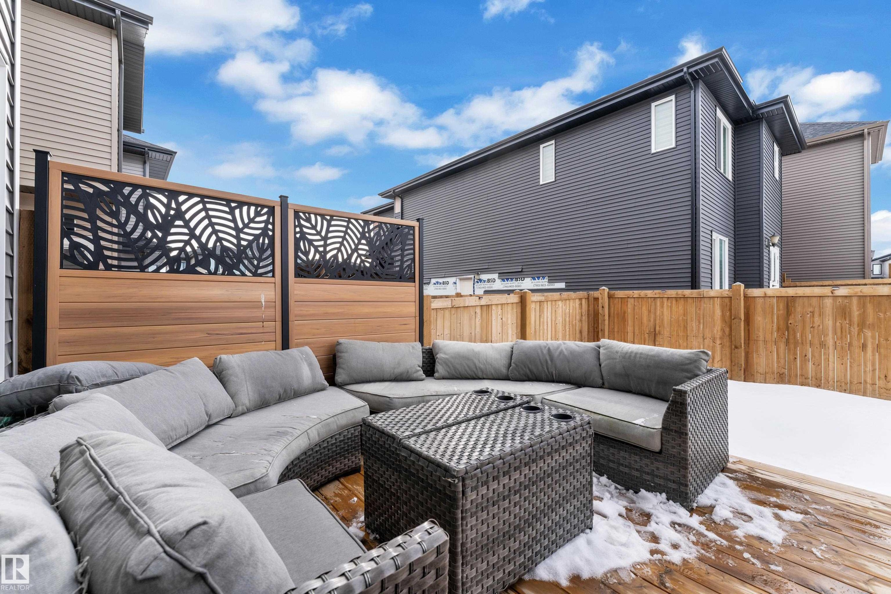 Wooden terrace featuring an outdoor lounge area and a fenced backyard - 16812 48 Street Nw, Edmonton, AB - Outdoor With Deck Patio Veranda With Exterior