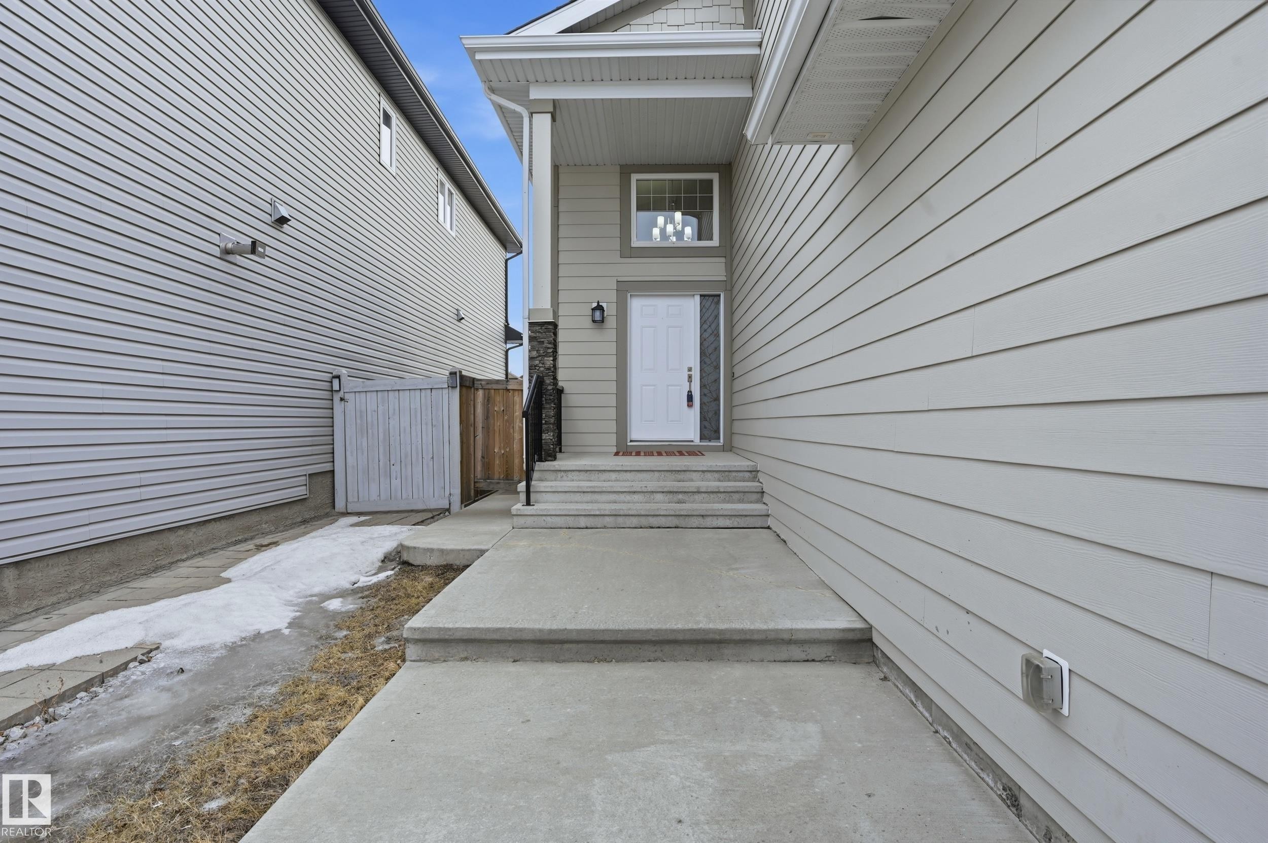 View of exterior entry - 1346 Cunningham Drive W, Edmonton, AB - Outdoor With Exterior