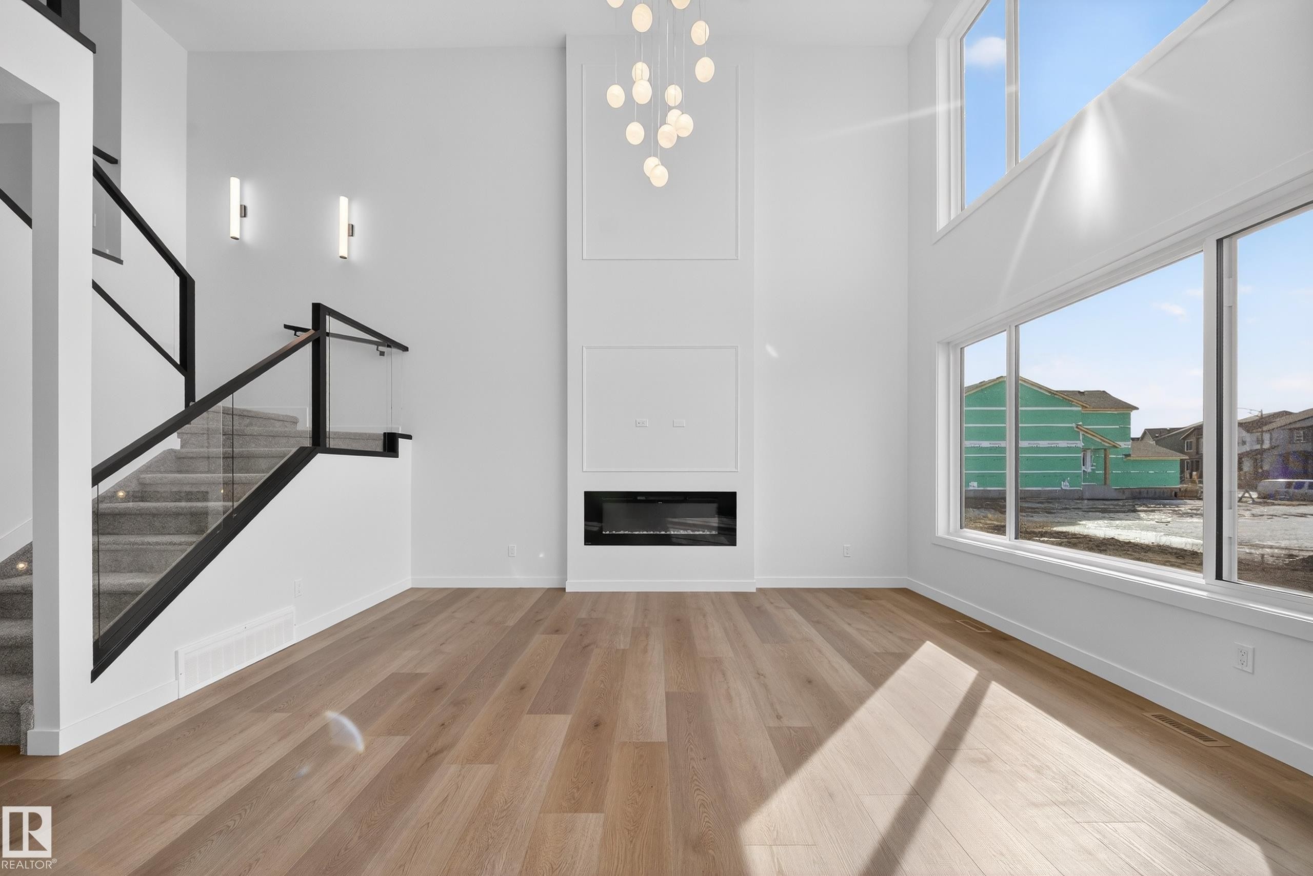 211 Paterson Link, Edmonton, AB - Indoor Photo Showing Other Room With Fireplace