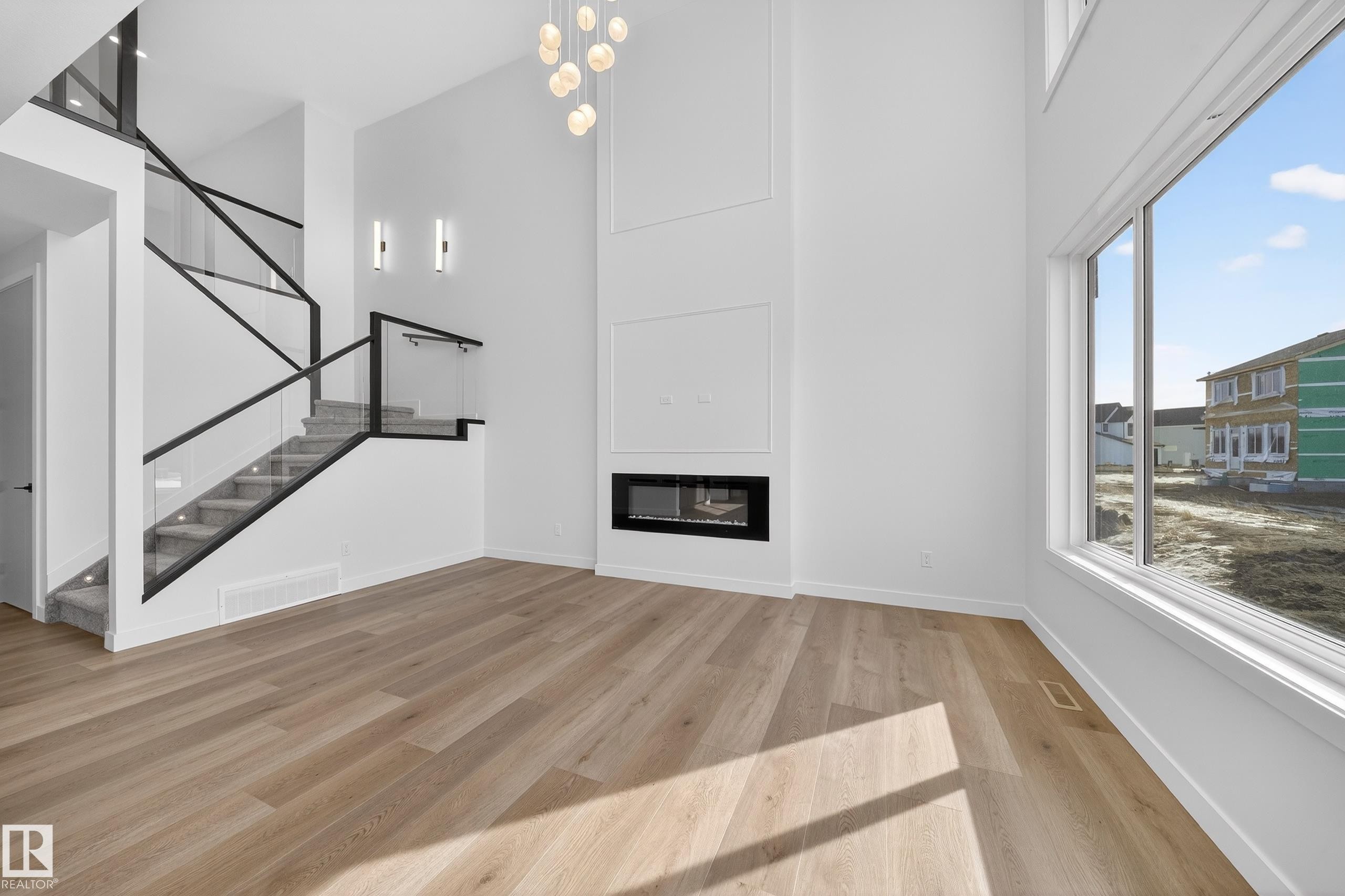 211 Paterson Link, Edmonton, AB - Indoor Photo Showing Other Room With Fireplace