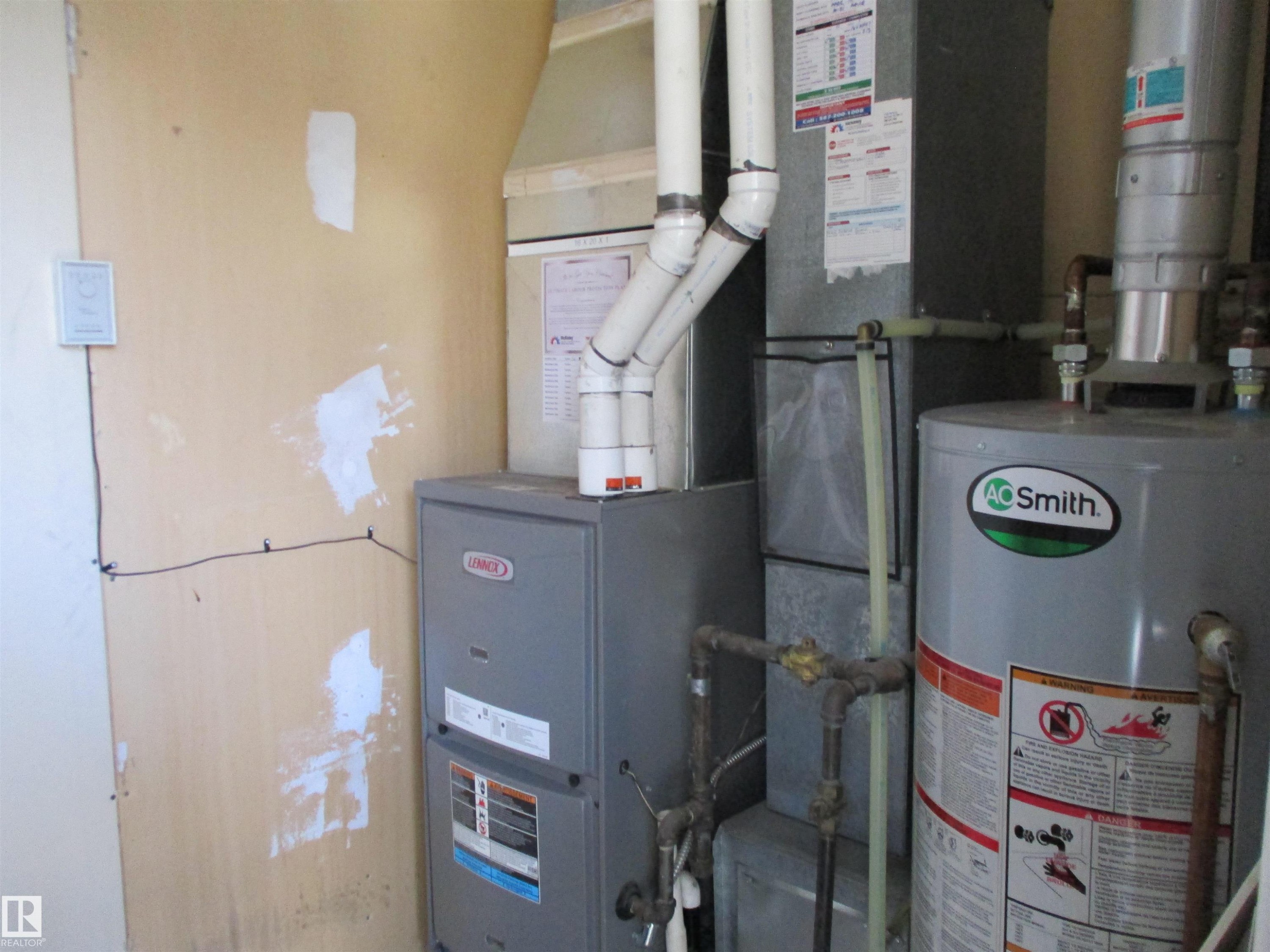 Utility room with water heater and heating unit - 1186 Saddleback Road, Edmonton, AB - Indoor Photo Showing Basement